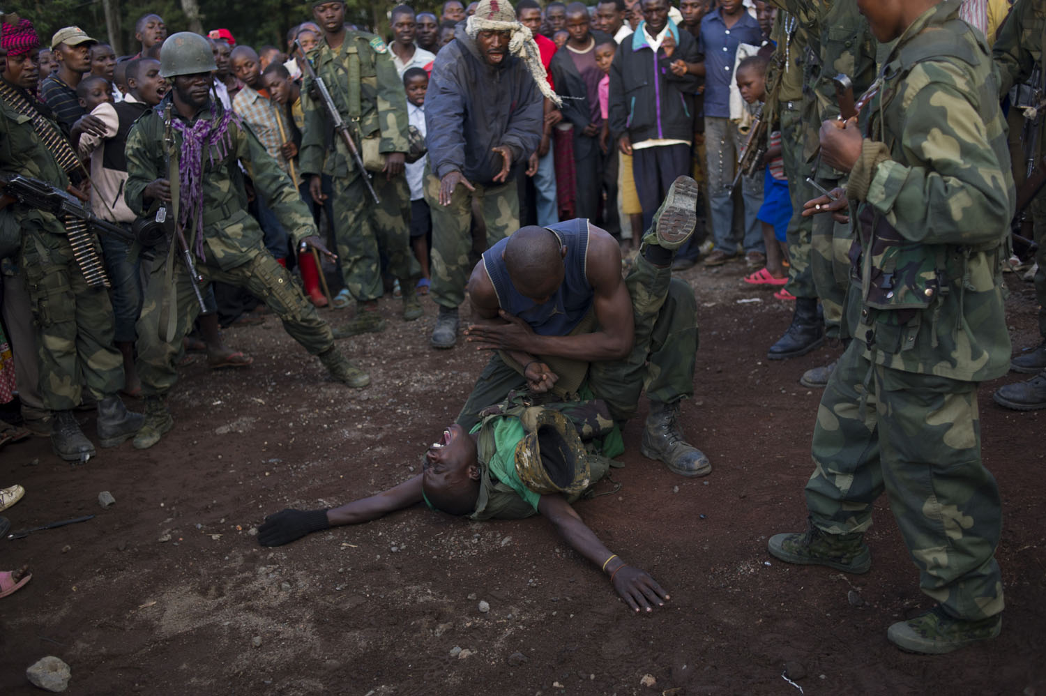 Congolese army soldiers, part of a Chinese trained commando group, celebrate with a karate demonstration following the capture of the town of Bunagana from M23 rebels in the east of the Democratic Republic of the Congo on October 30, 2013. The army took the major border town just an hour earlier, representing a major blow to the rebels.