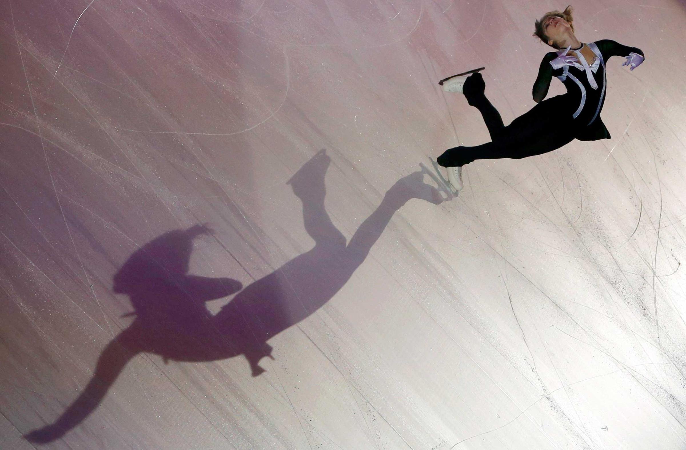A shadow is cast on the ice as Julia Lipnitskaia of Russia performs during the gala exhibition at the ISU Bompard Trophy Figure Skating event in Bordeaux