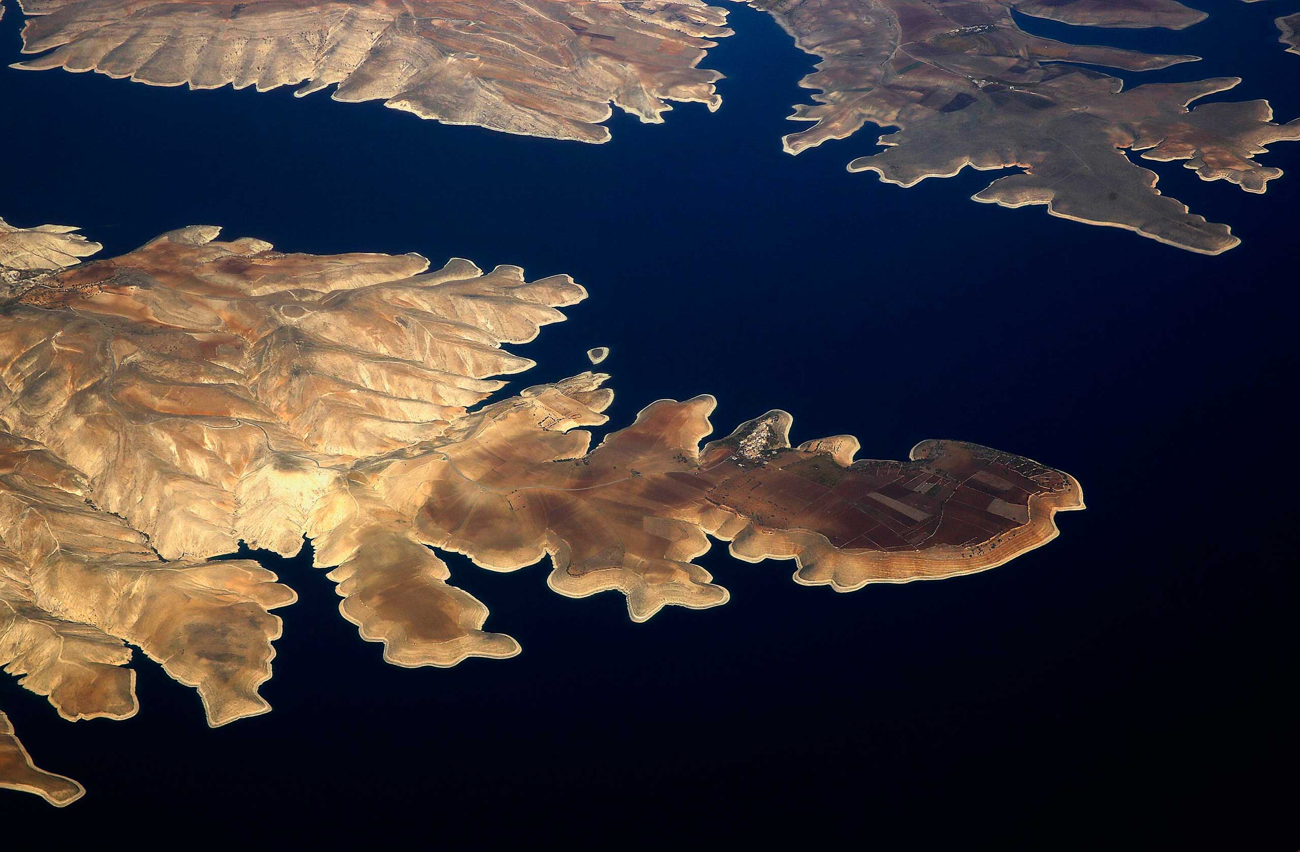 Nov. 10, 2014. The town of Susuz is seen on the northern shore of the Ataturk dam through the window of a passenger aircraft flying over south-eastern Turkey province of Adiyaman.