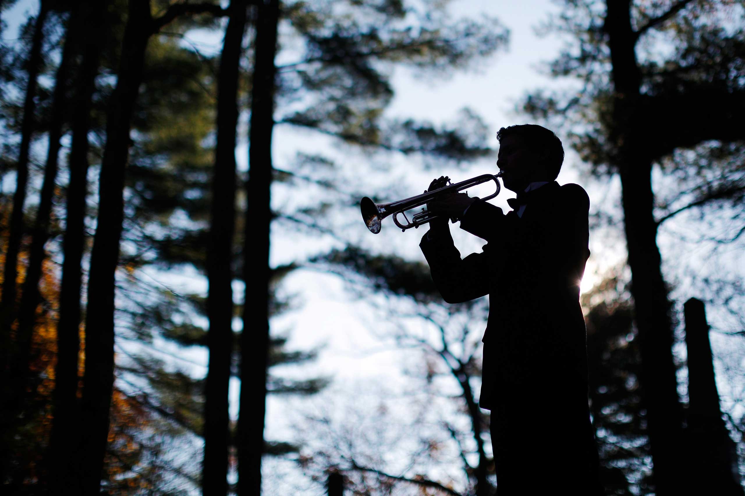 Nov. 11, 2014. Moses Riley plays  Taps  during Veterans Day ceremonies in Concord, Mass.