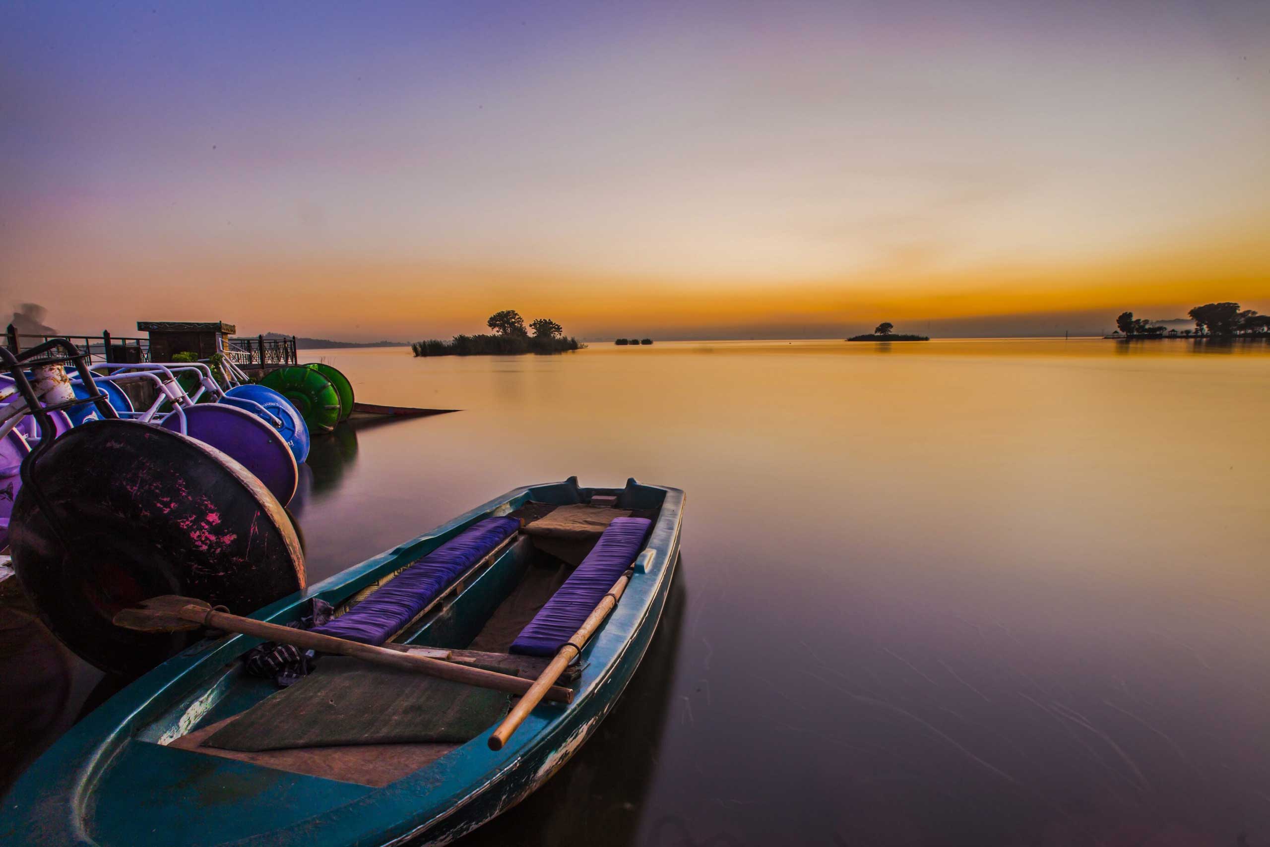 Nov. 12, 2014. A long exposure shot shows boats fastened at the Lake View picnic point as the sun sets in Islamabad, Pakistan.