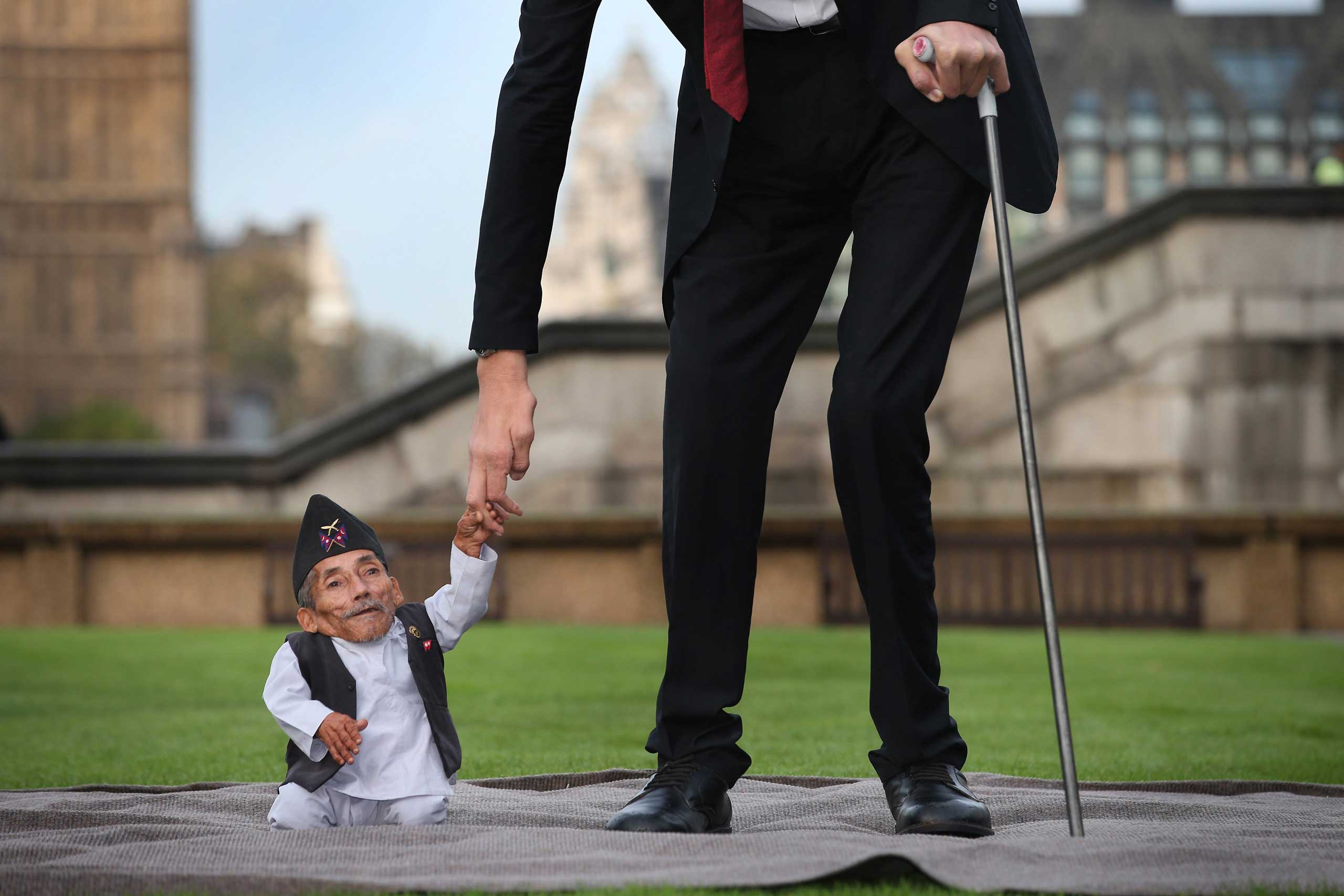 Nov. 13, 2014. Chandra Bahadur Dangi, the shortest man ever, meets the worlds tallest man, Sultan Kosen, for the first time in London. Dangi from Nepal is 21.5-in. tall, and Kosen from Turkey is 8 ft. 3 in.