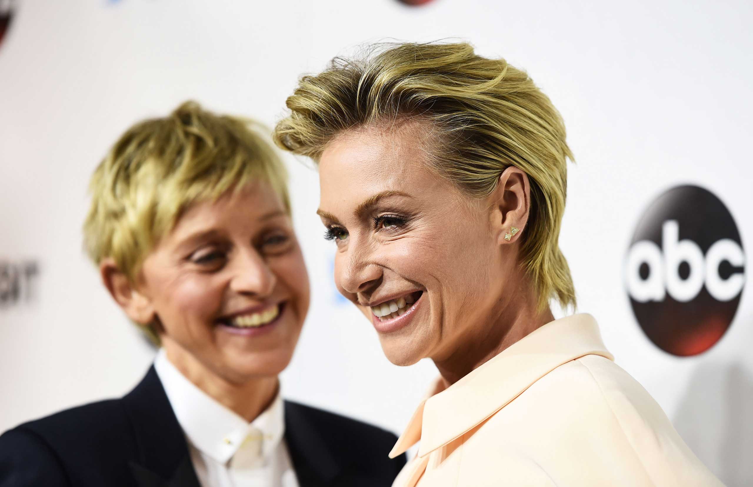 DeGeneres (L) and actress Portia de Rossi arrive at the #TGIT Premiere Event hosted by Twitter at Palihouse Holloway in West Hollywood, Calif. on Sept. 20, 2014. (Amanda Edwards—WireImage/Getty Images)