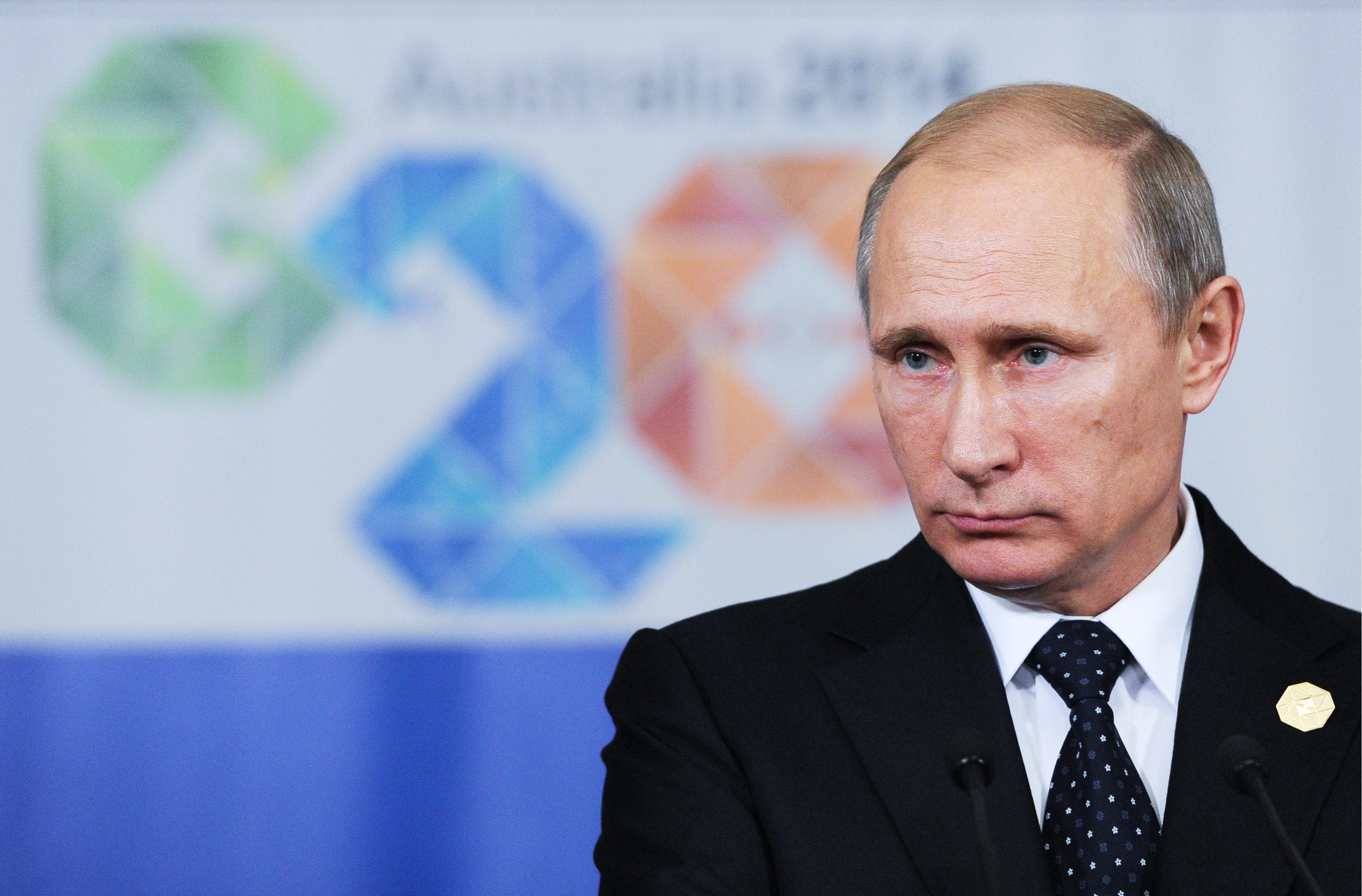 Russia's President Vladimir Putin looks on at a press conference following the G20 Leaders' Summit in Brisbane, Australia. (Klimentyev Mikhail—EPA)