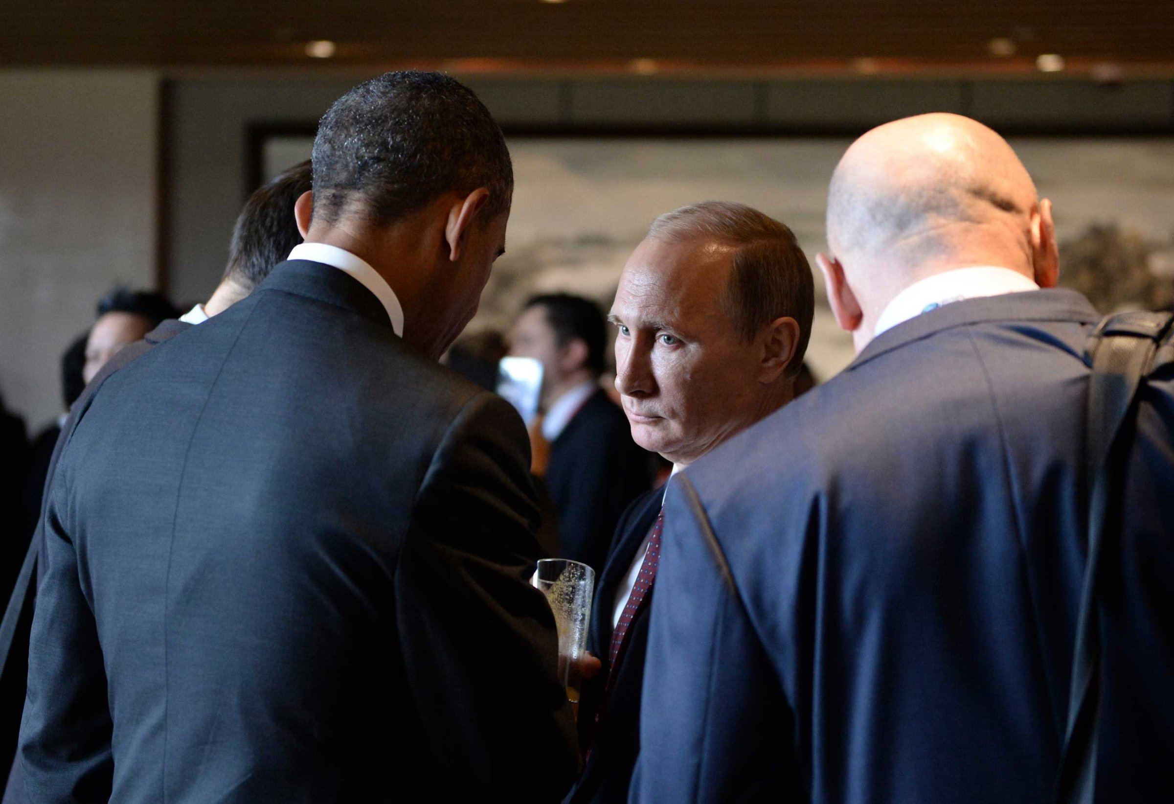 Russian President Vladimir Putin seen talking to President Barack Obama during the Asia Pacific Economic Cooperation Summit in Beijing, Nov. 11, 2014.