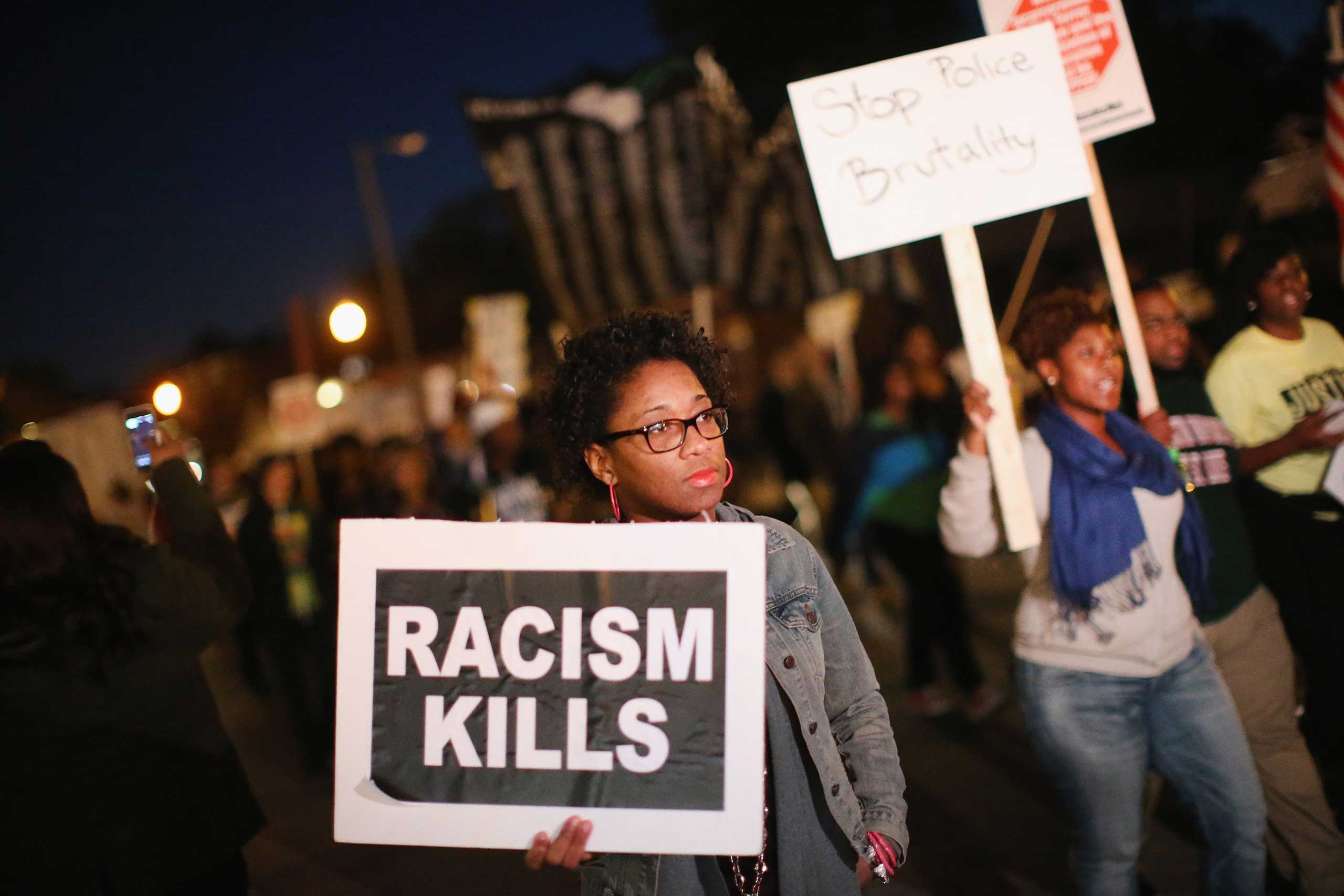 Demonstrators march toward the police station as protests continue in the wake of 18-year-old Michael Brown's death on Oct. 22, 2014 in Ferguson, Mo. (Scott Olson—Getty Images)