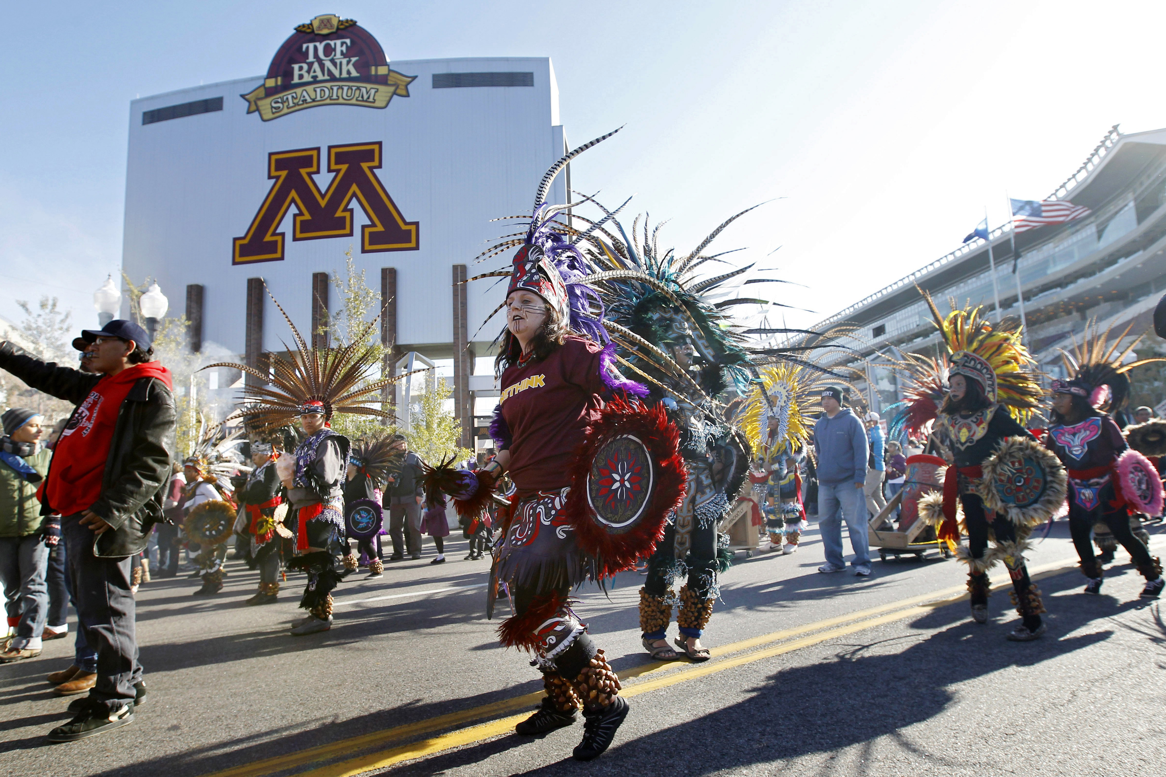 Protestors march outside TCF Bank Stadium before an NFL football game between the Minnesota Vikings and the Washington Redskins on Nov. 2, 2014, in Minneapolis.