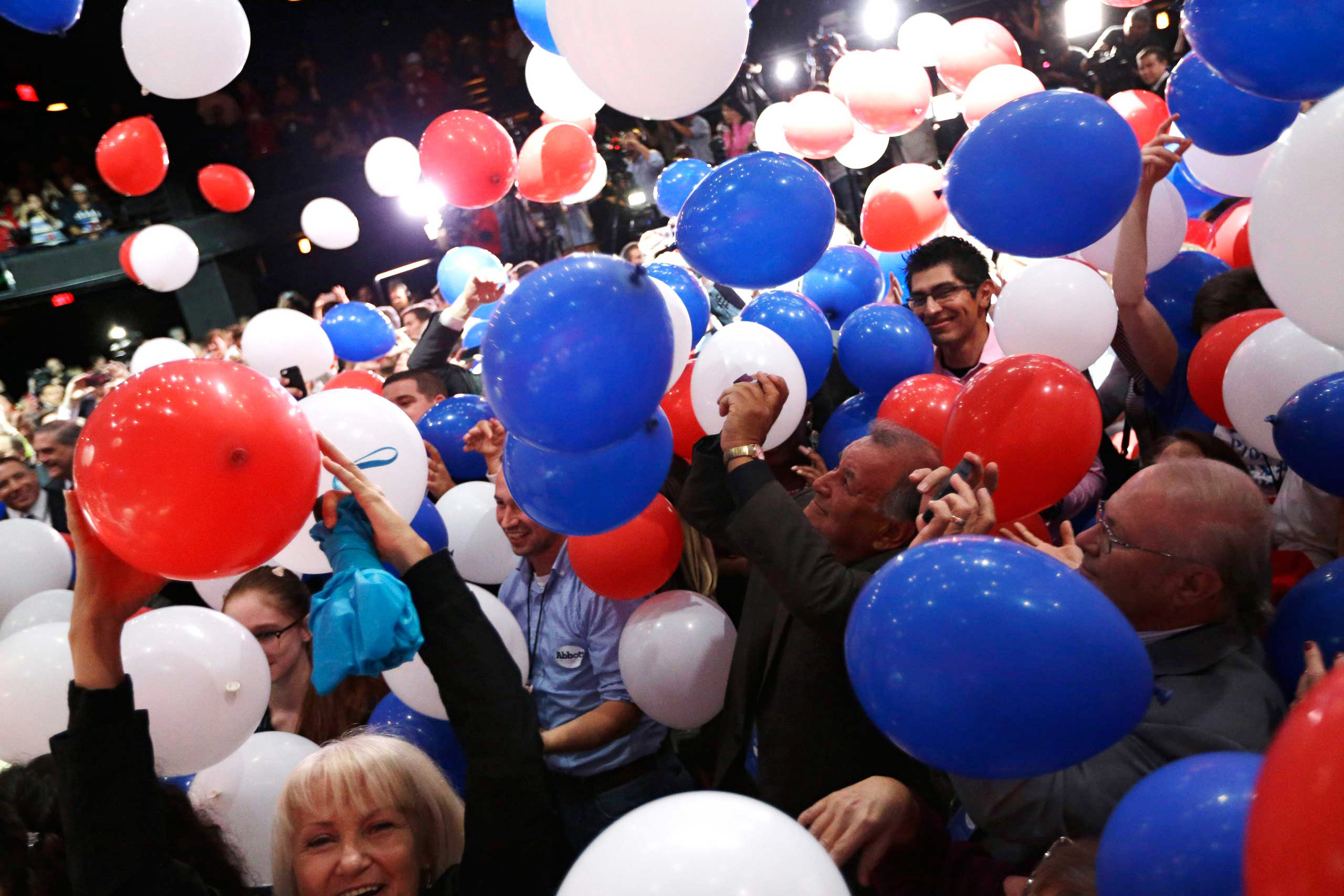Supporters cheer as balloons fall after Texas Attorney General and Republican candidate for governor Greg Abbott's victory speech in Austin on Nov. 4, 2014. (David J. Phillip—AP)