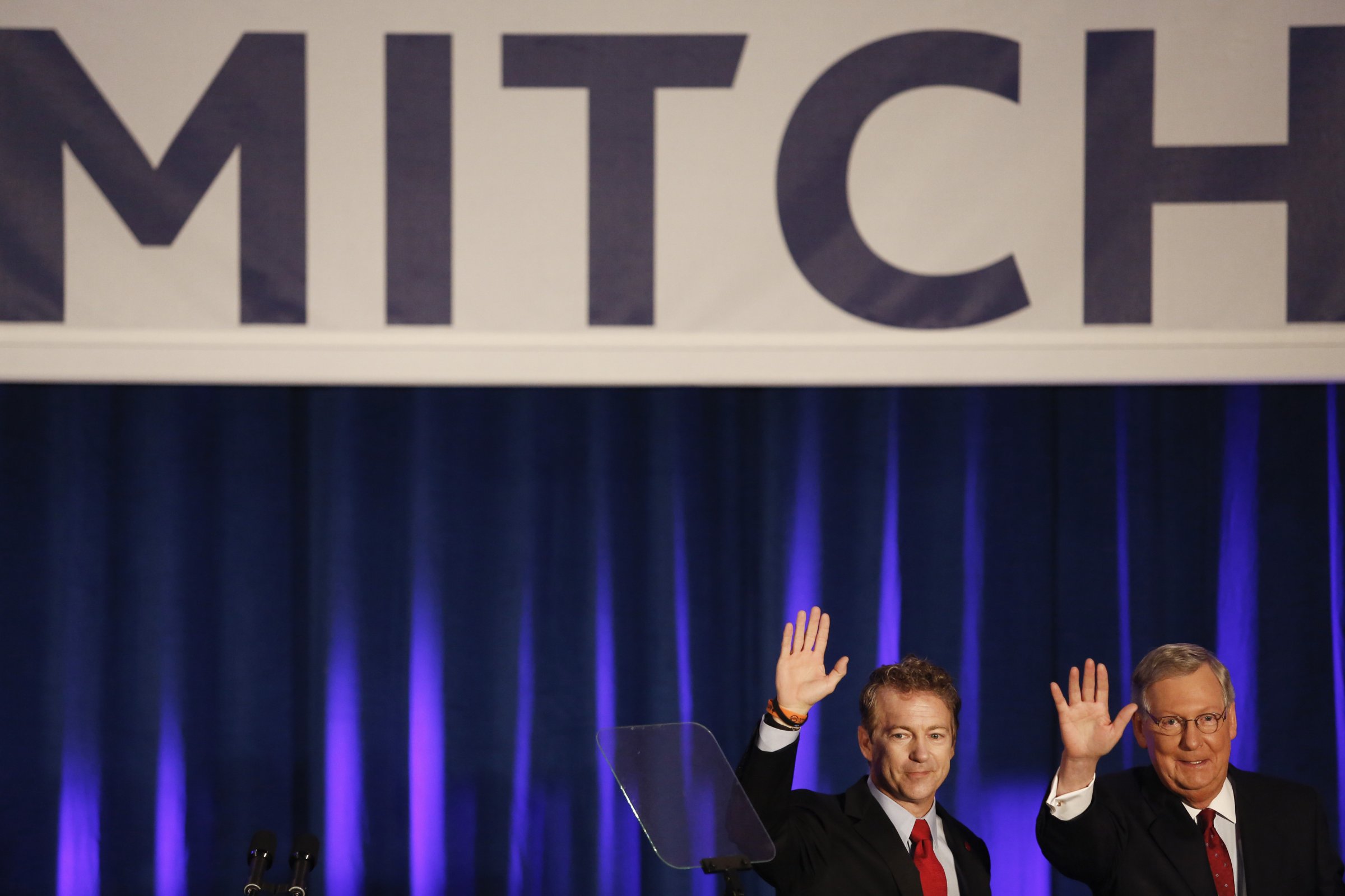 Senate Minority Leader Mitch McConnel and Senator Rand Paul wave to supporters at a Republican Party of Kentucky election night party in Louisville on Nov. 4, 2014.