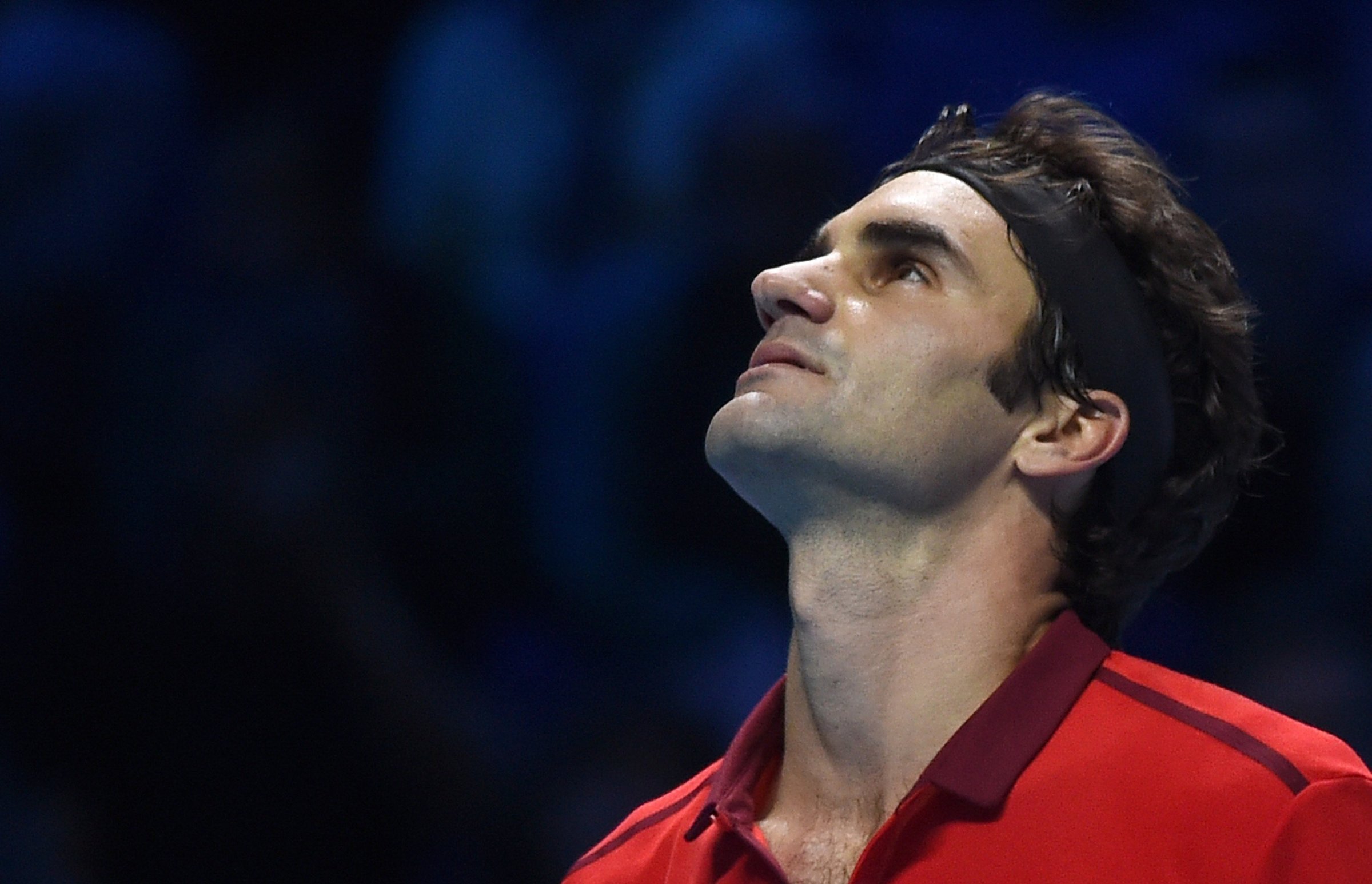 Roger Federer looks up during his singles ATP World Tour Finals semifinal tennis match against Switzerlands Stan Wawrinka at the O2 Arena in London on Nov. 15, 2014.