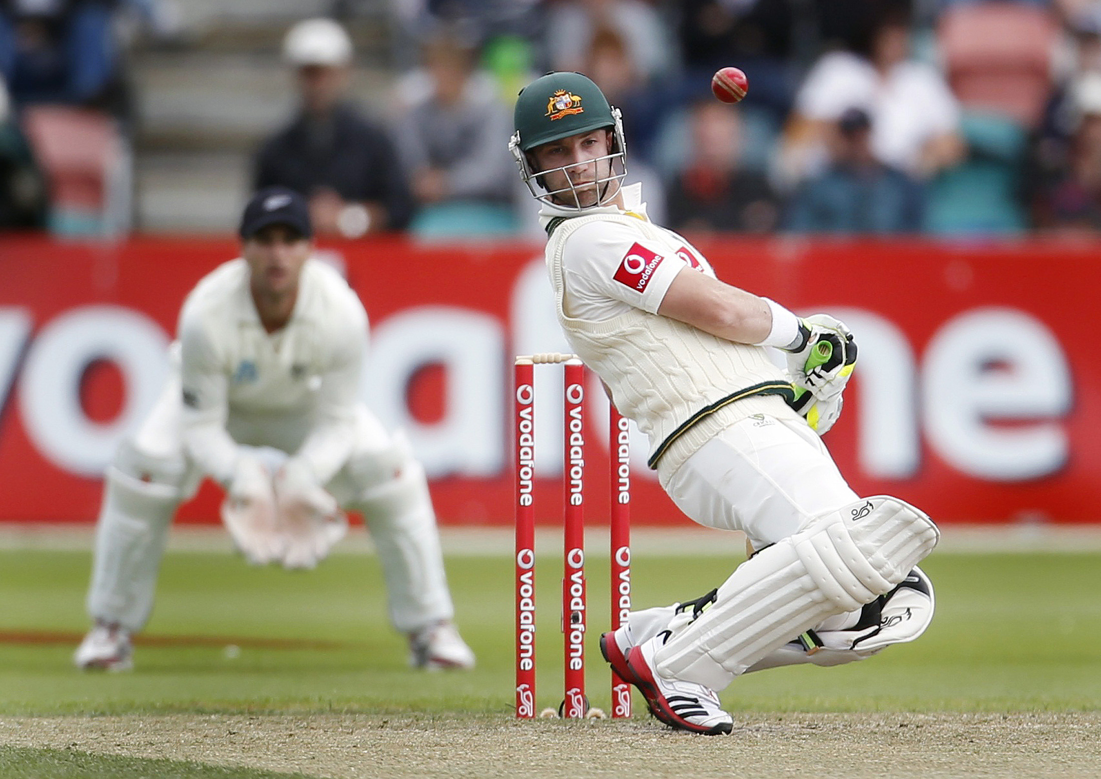 Australia's Hughes avoids a high ball during the second cricket test match against New Zealand in Hobart