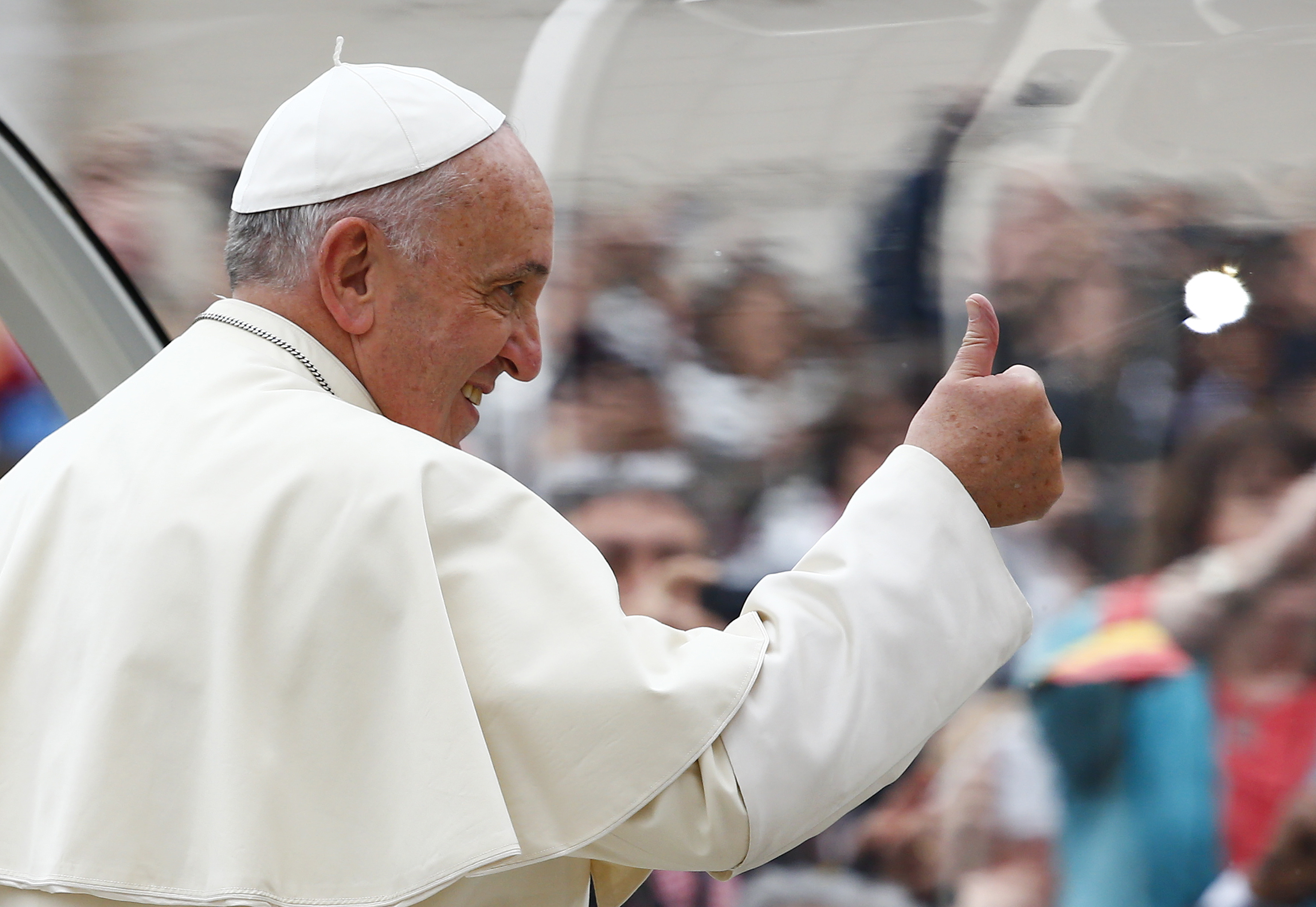 Pope Francis gestures as he arrives to lead his weekly general audience in Saint Peter's Square at the Vatican November 12, 2014. (Tony Gentile—Reuters)