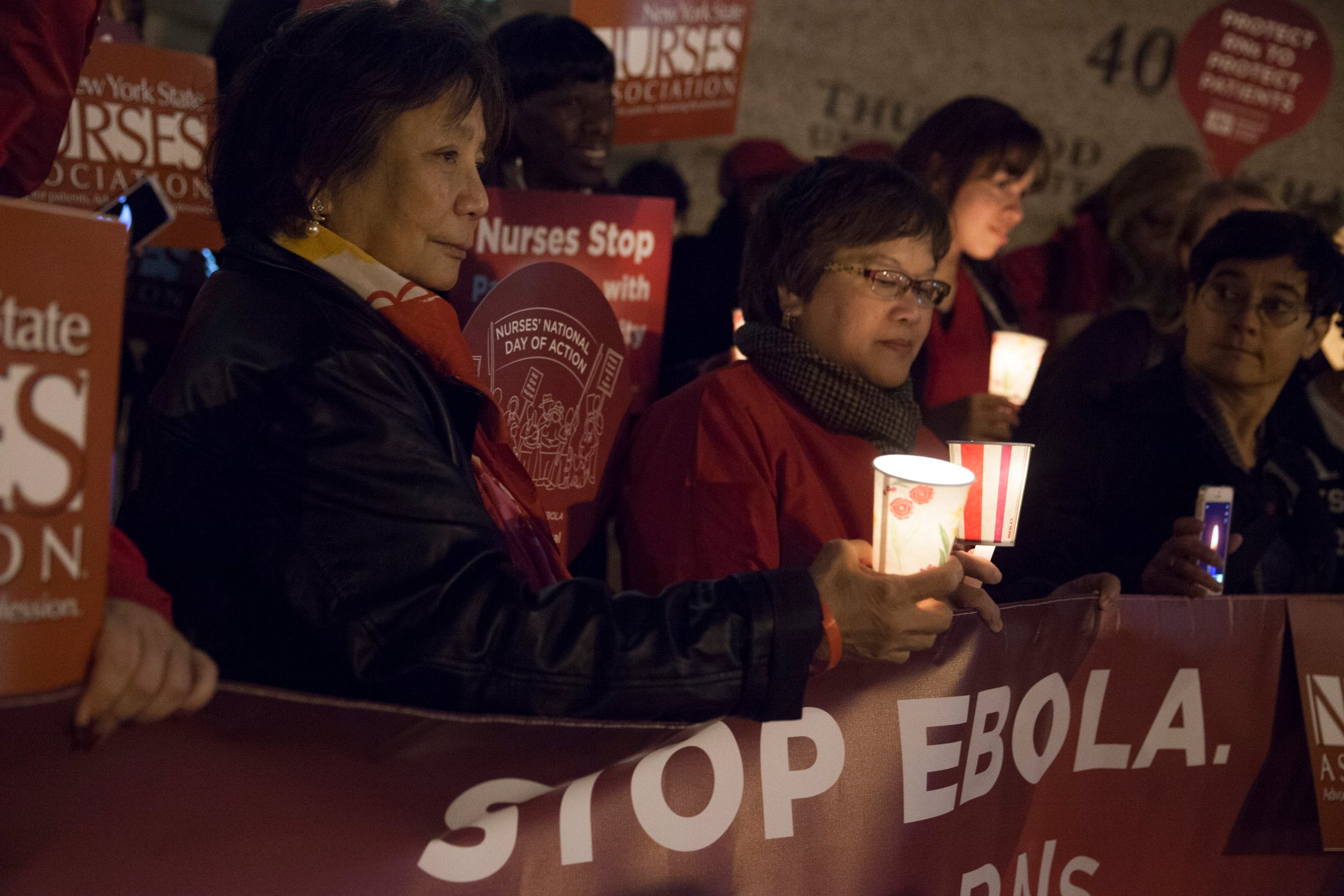 Nurses from the New York State Nurses Association protest for improved Ebola safeguards, part of a national day of action, in New York