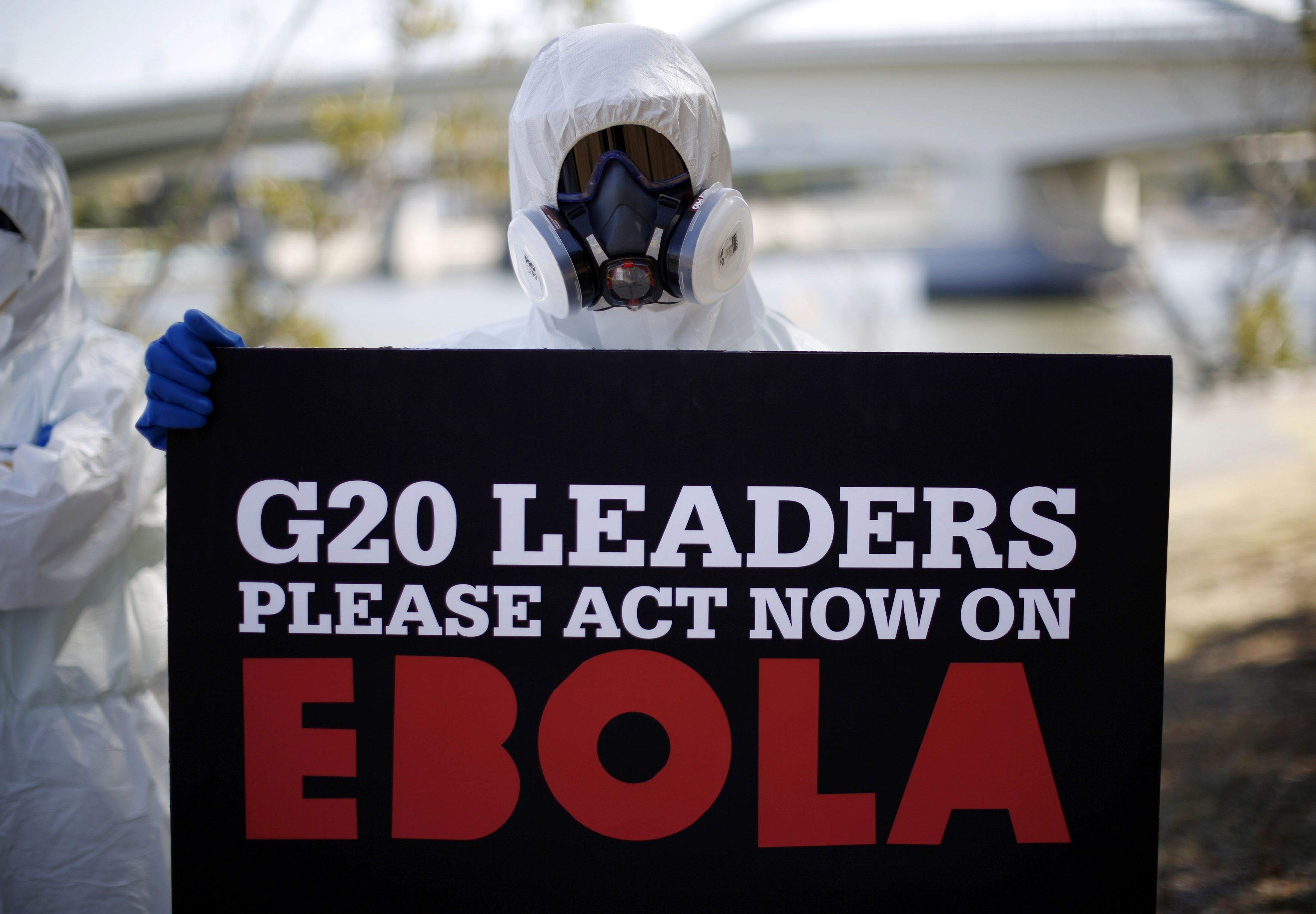A protester dressed in protective equipment demonstrates, calling for for G20 leaders to address the Ebola issue, near the G20 leaders summit venue in Brisbane Nov. 15, 2014 (Jason Reed—Reuters)