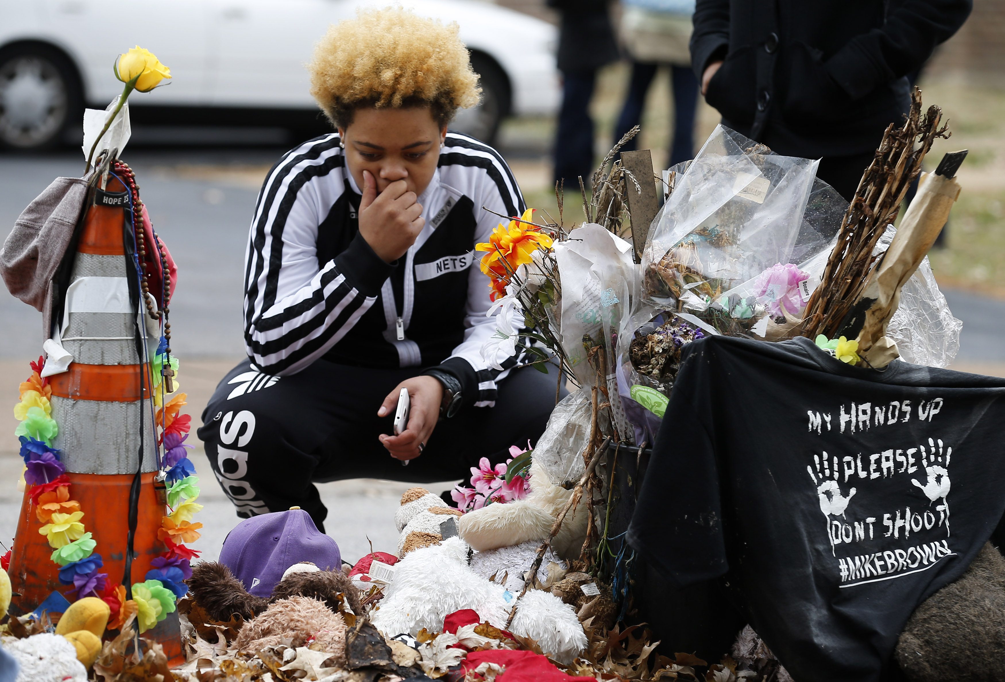 A woman stops to visit the memorial set up where Michael Brown was shot and killed in Ferguson, Missouri, Nov. 22, 2014. (Jim Young—Reuters)