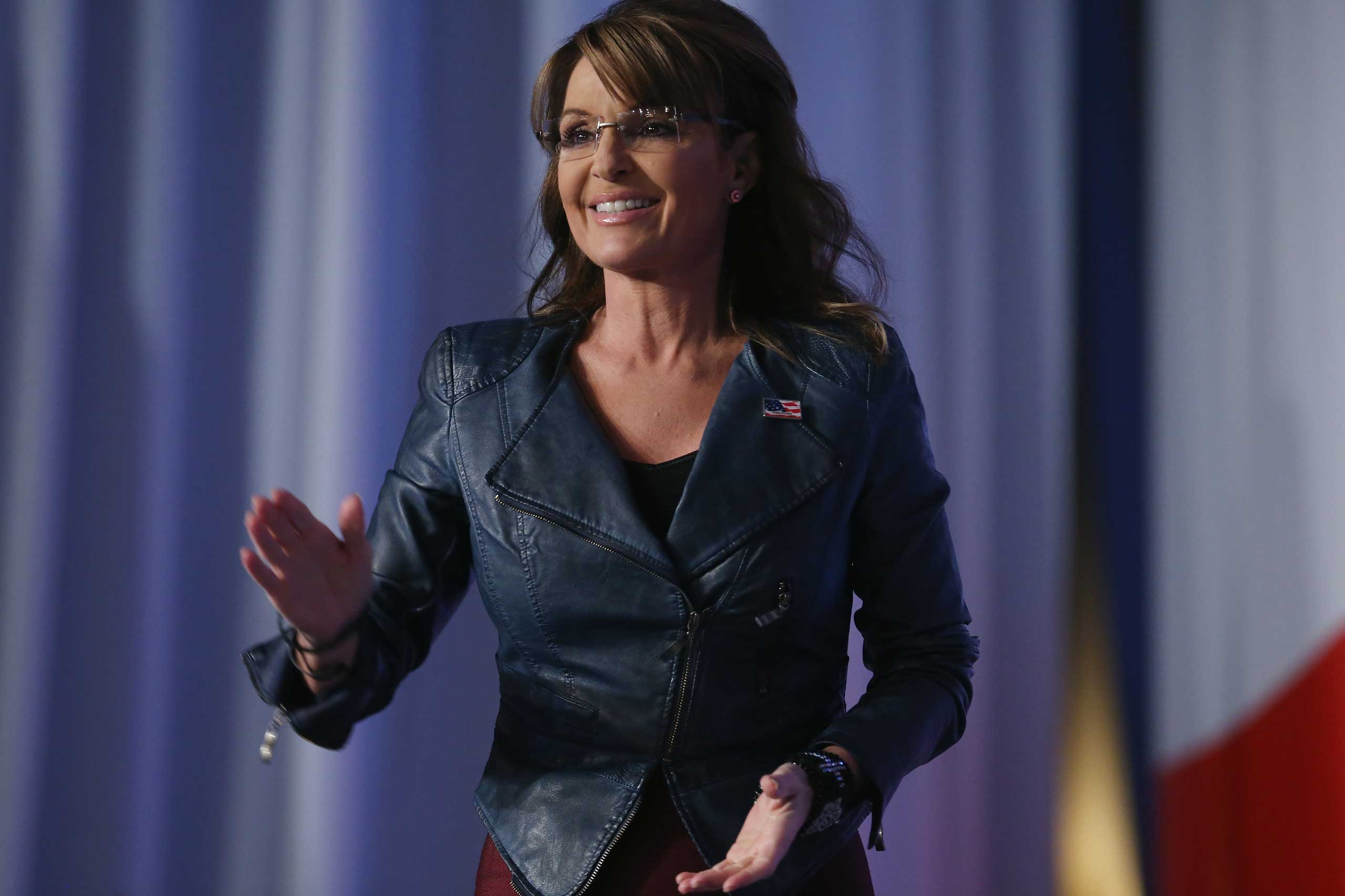 Former Alaska Gov. Sarah Palin (R) walks onstage to speak at the 2014 Values Voter Summit in Washington on Sept. 26, 2014.