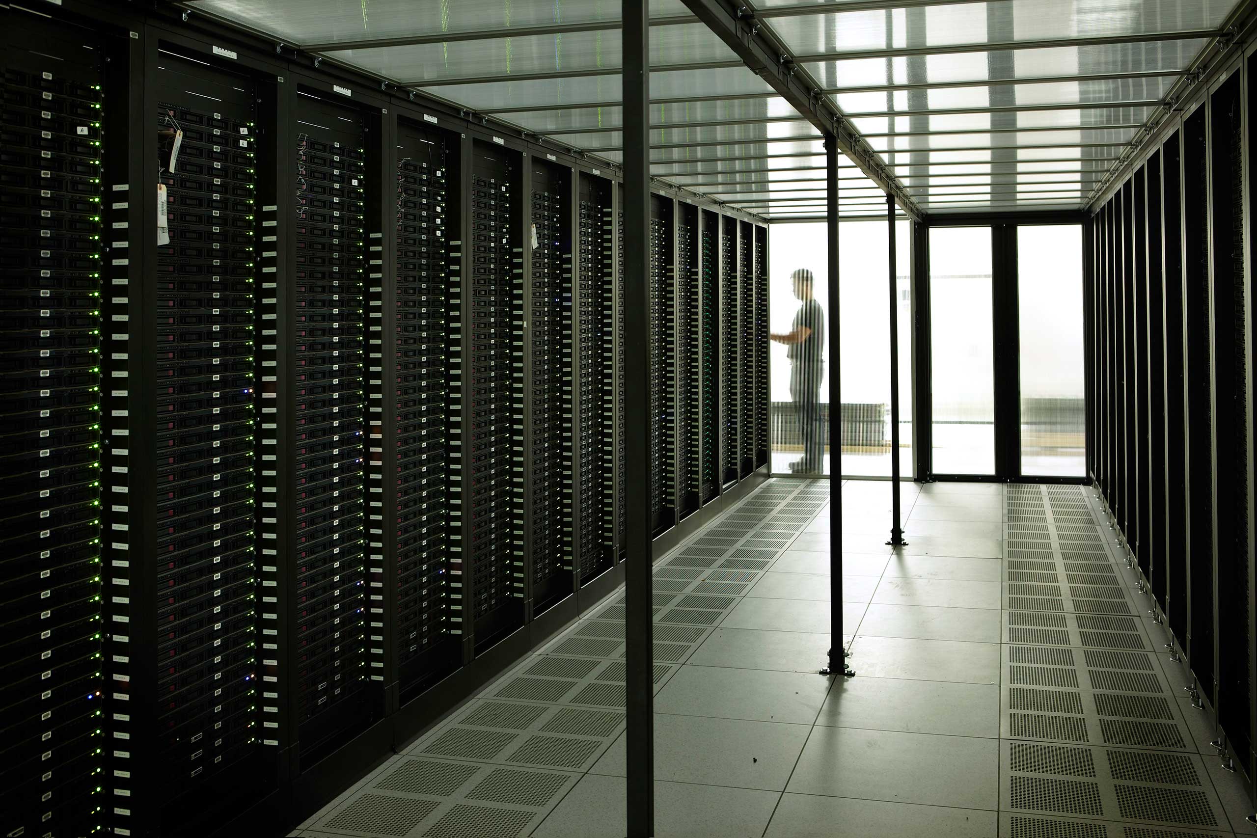 These rows of servers are set up to minimize the energy required to keep the data center running.
