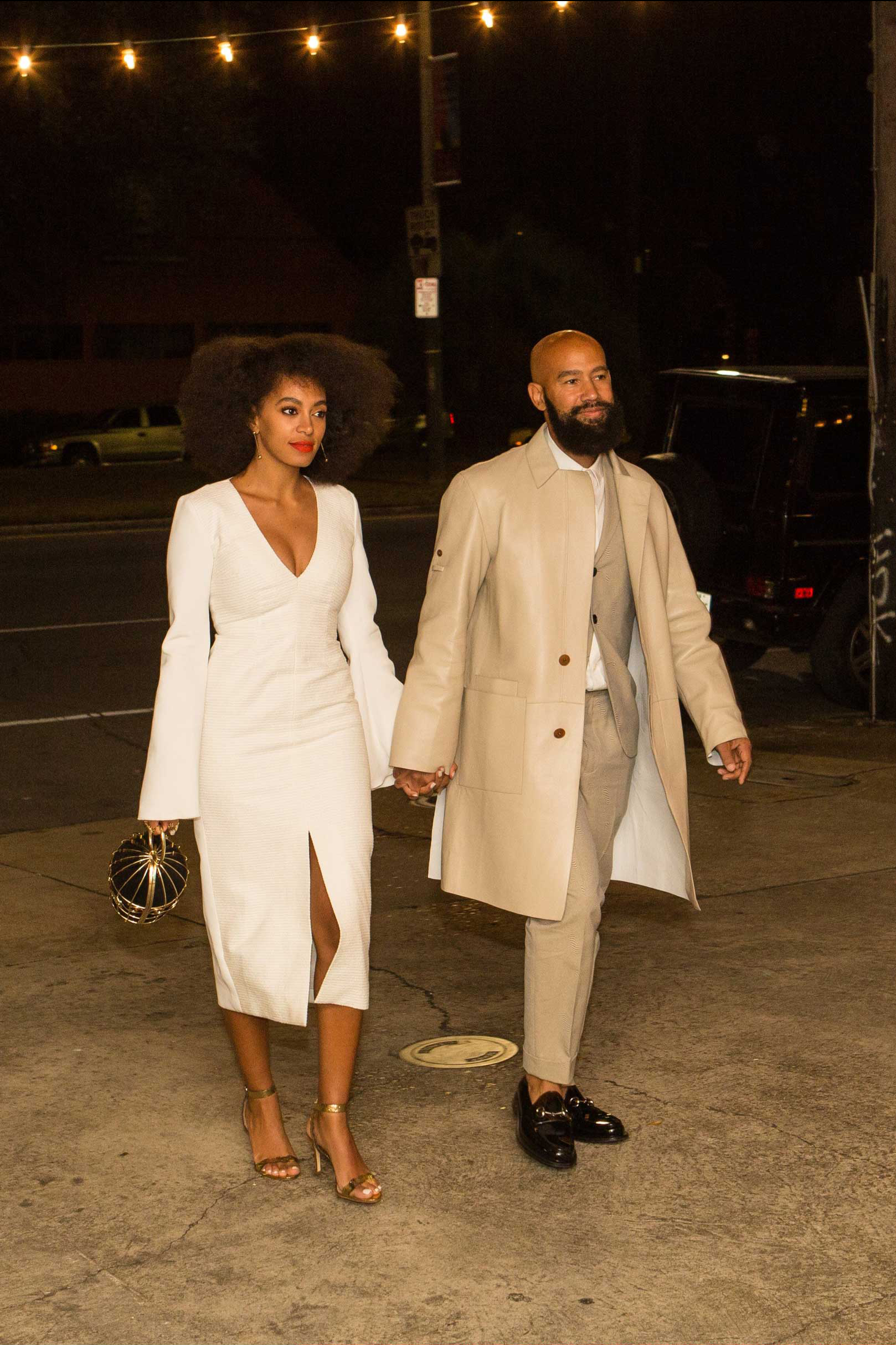 Musician Solange Knowles (L) and her fiancee, music video director Alan Ferguson, are seen outside the Indywood Cinema in New Orleans on Nov. 14, 2014. (Josh Brasted—GC Images/Getty Images)