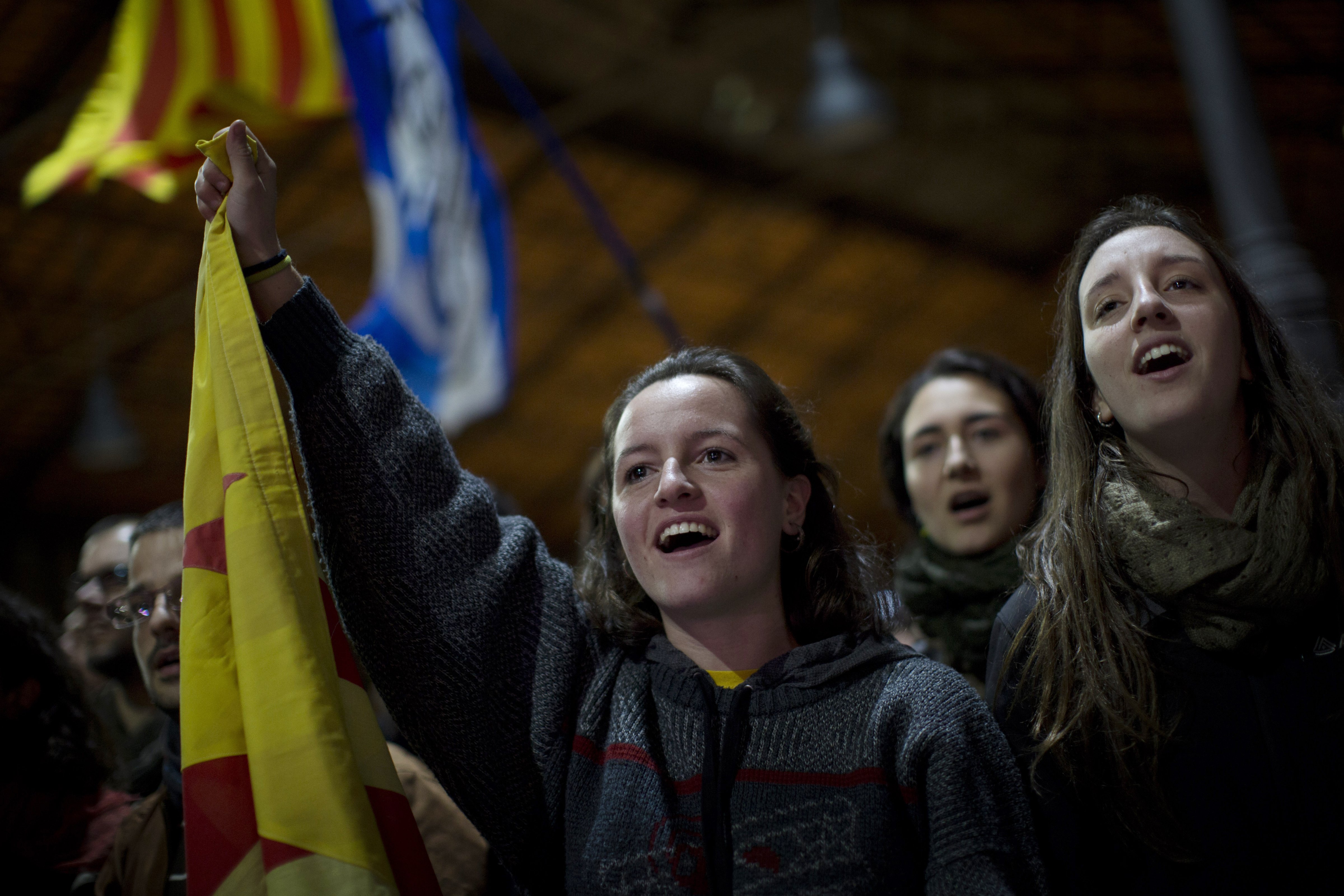 Pro independence supporters celebrate the results of an informal poll for the independence of Catalonia in Barcelona, Spain, Sunday, (Emilio Morenatti—AP)