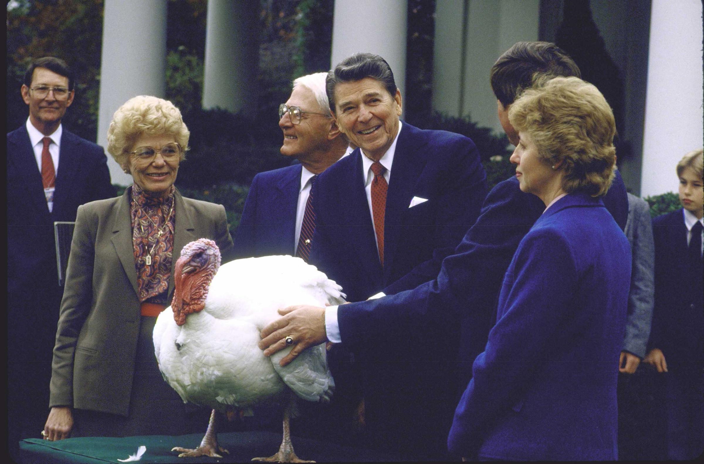 Pres Ronald Reagan w thanksgiving turkey and farmer John H