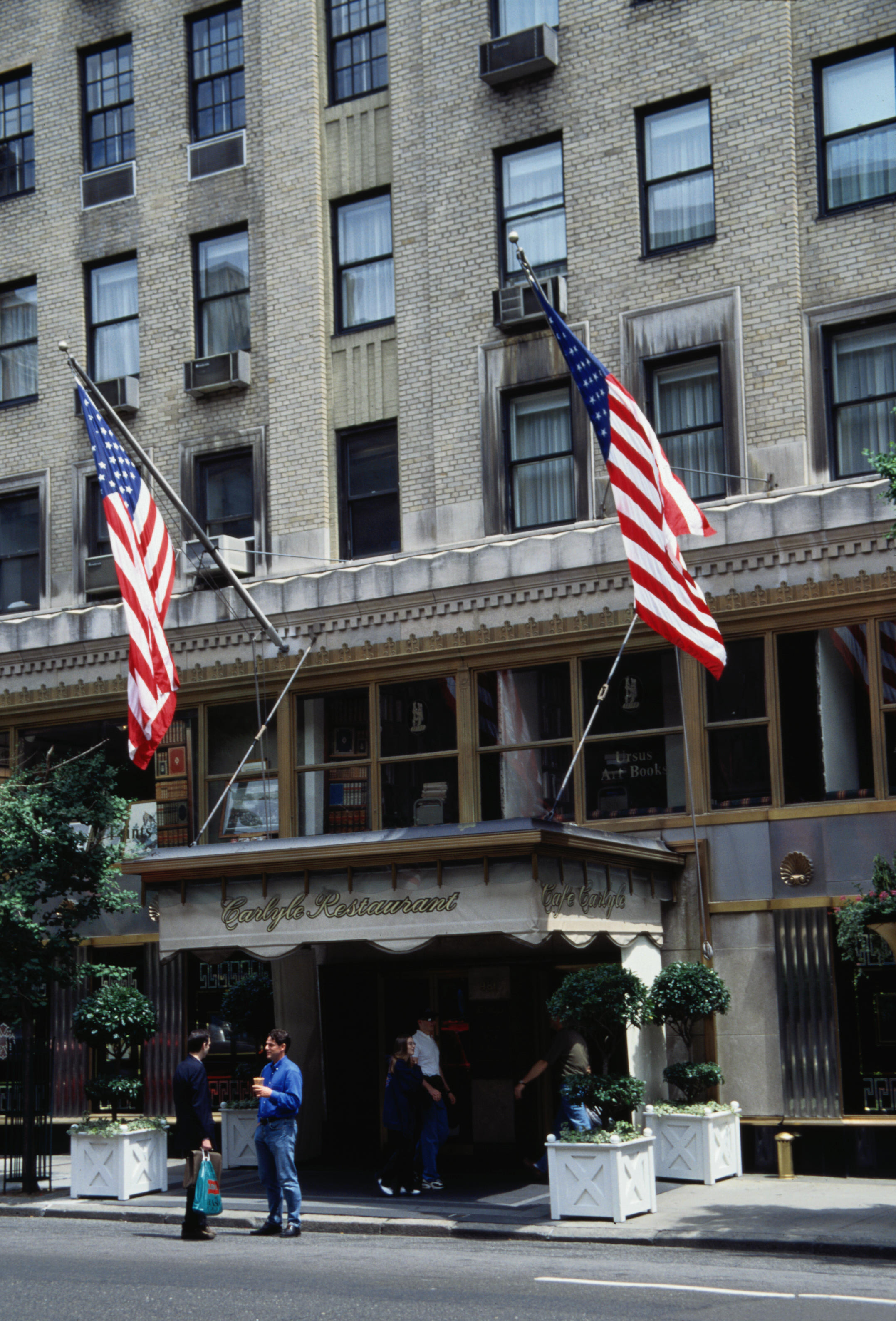 People standing in front of the Carlyle Hotel.