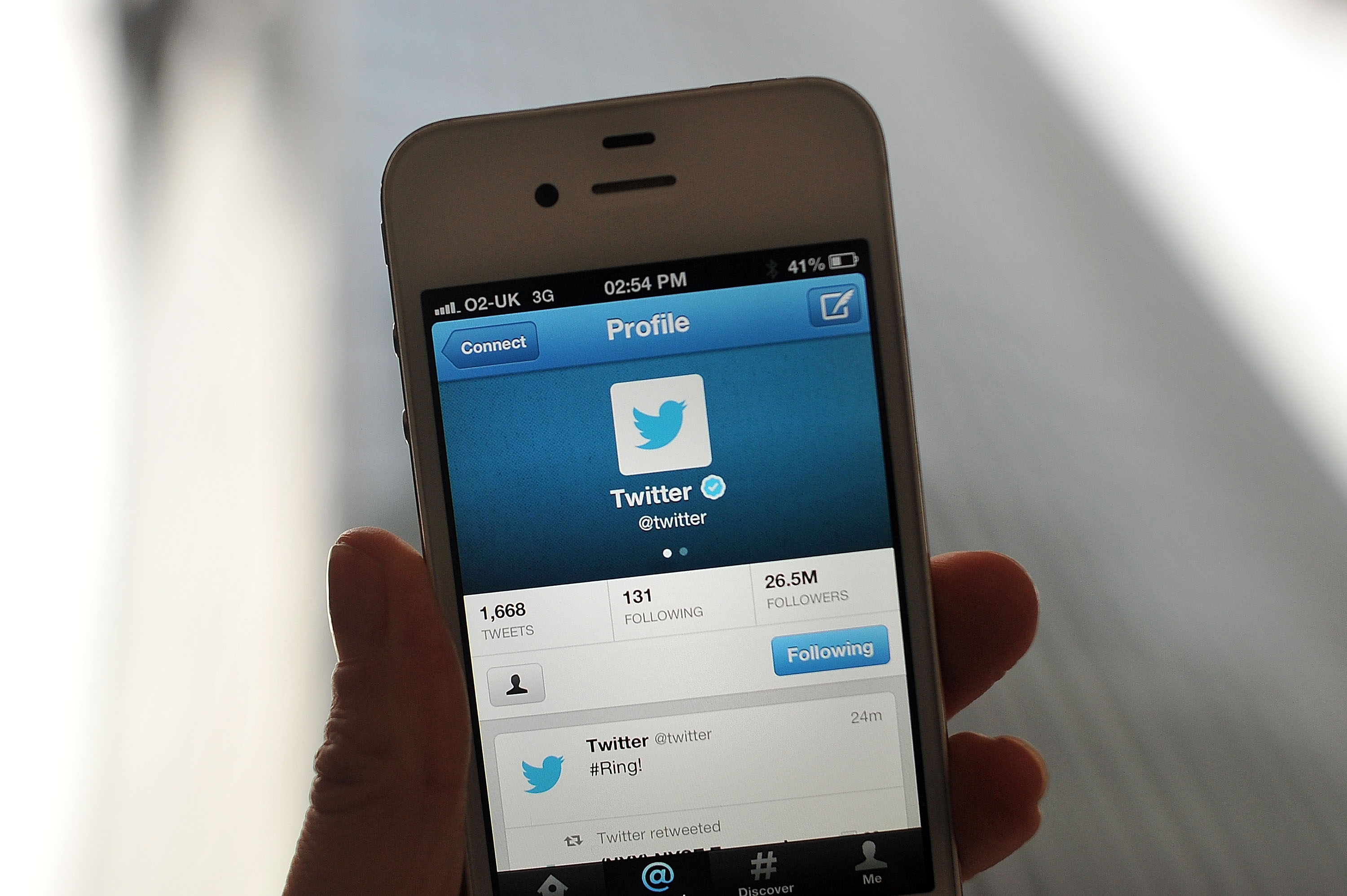 The Twitter logo and hashtag '#Ring!' is displayed on a mobile device. (Bethany Clarke—Getty Images)