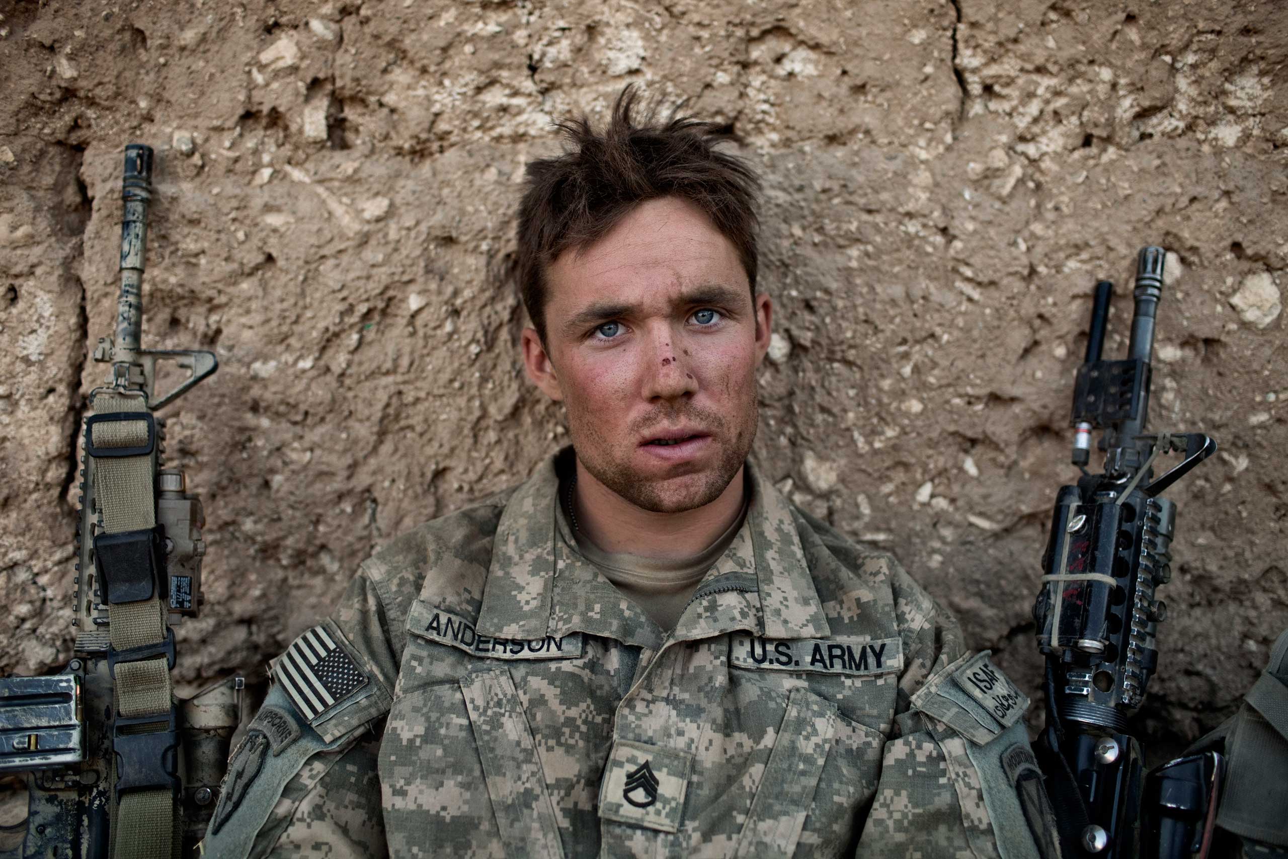 Army Sergeant Cody Anderson.
                              Adam Ferguson, Sept. 11, 2009. Tangi Valley, Afghanistan.
                              
                               In 2009, on a military operation in Afghanistan’s notorious Tangi Valley, I made this picture of U.S. Army Sergeant Cody Anderson. Six months later, after he retuned home, he was found dead in his apartment in Watertown, N.Y. It wasn’t officially called a suicide, but Anderson had been diagnosed with PTSD and was struggling with life at home. Anderson had served in Iraq also, so he knew the backwaters of America’s wars intimately. There was much Anderson couldn’t reconcile about the U.S. mission in Afghanistan, and he wasn’t scared to tell me about it. If I made a picture that epitomizes the ‘1000 yard stare’, this is it. To me this image signifies the emotional toll caused by war, damage that is not easily washed away when the war is over.”