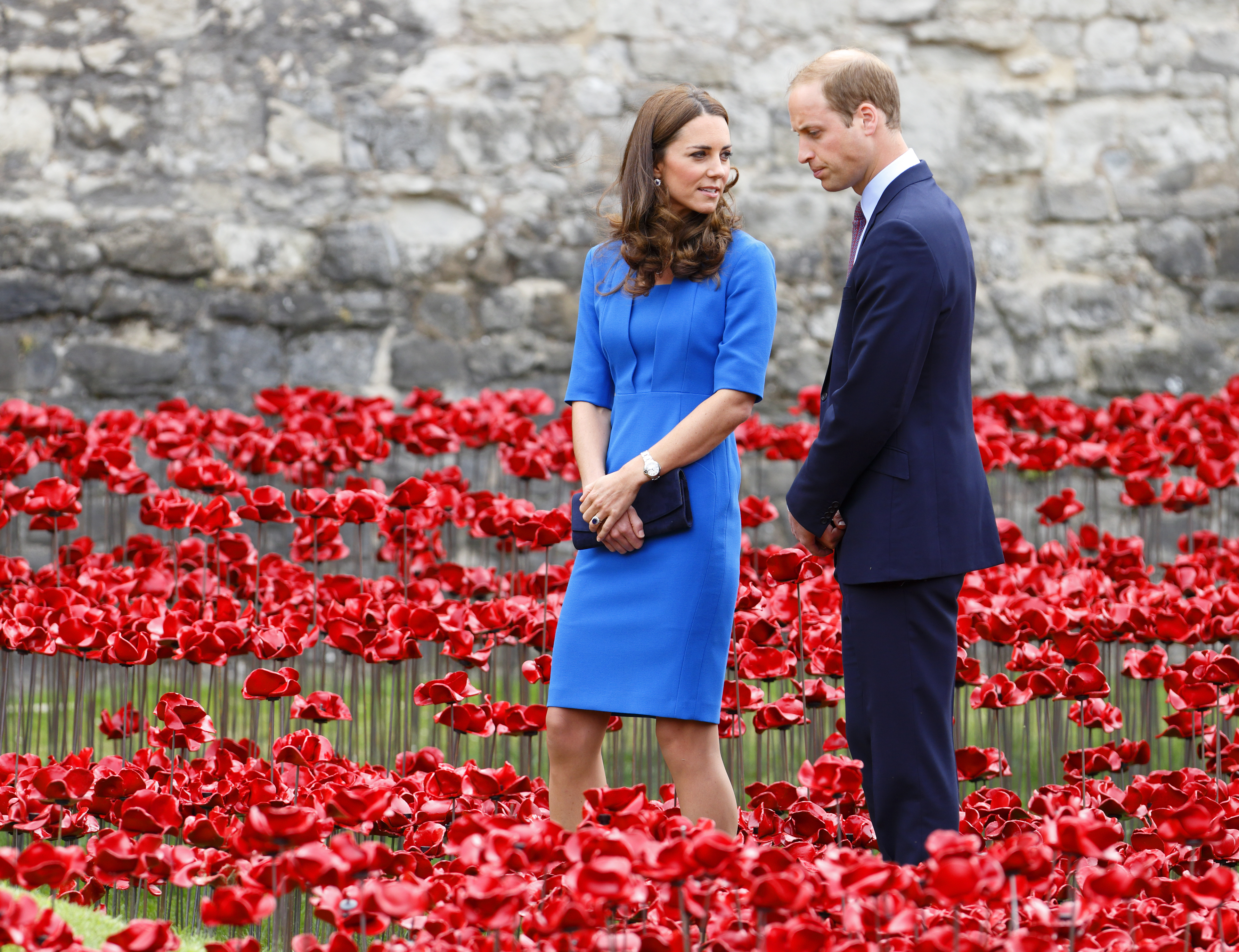 Catherine, Duchess of Cambridge and Prince William, Duke of Cambridge walk through a poppy field art installation entitled 'Blood Swept Lands and Seas of Red' by artist Paul Cummins, in the moat of the Tower of London, to commemorate the First World War on August 5, 2014 in London, England. (Max Mumby&mdash;Indigo/Getty Images)