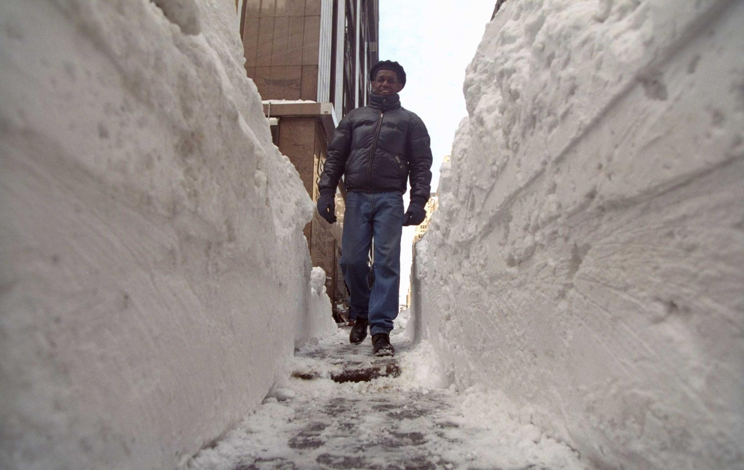 Huge tunnels dug out of the snow allow New Yorkers to get on