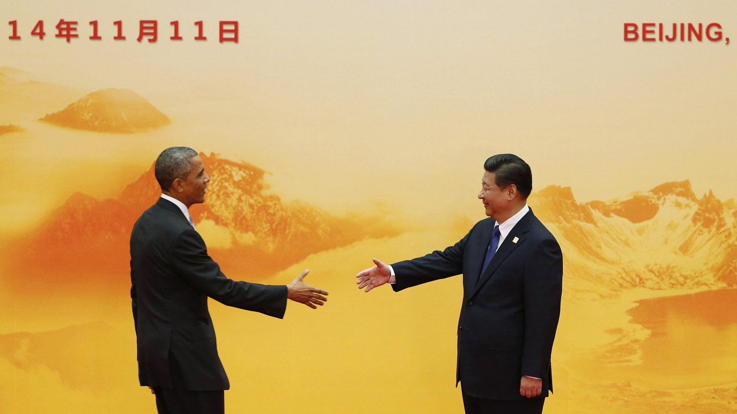 U.S. President Obama shakes hands with China's President Xi during the APEC forum, at the International Convention Center in Beijing