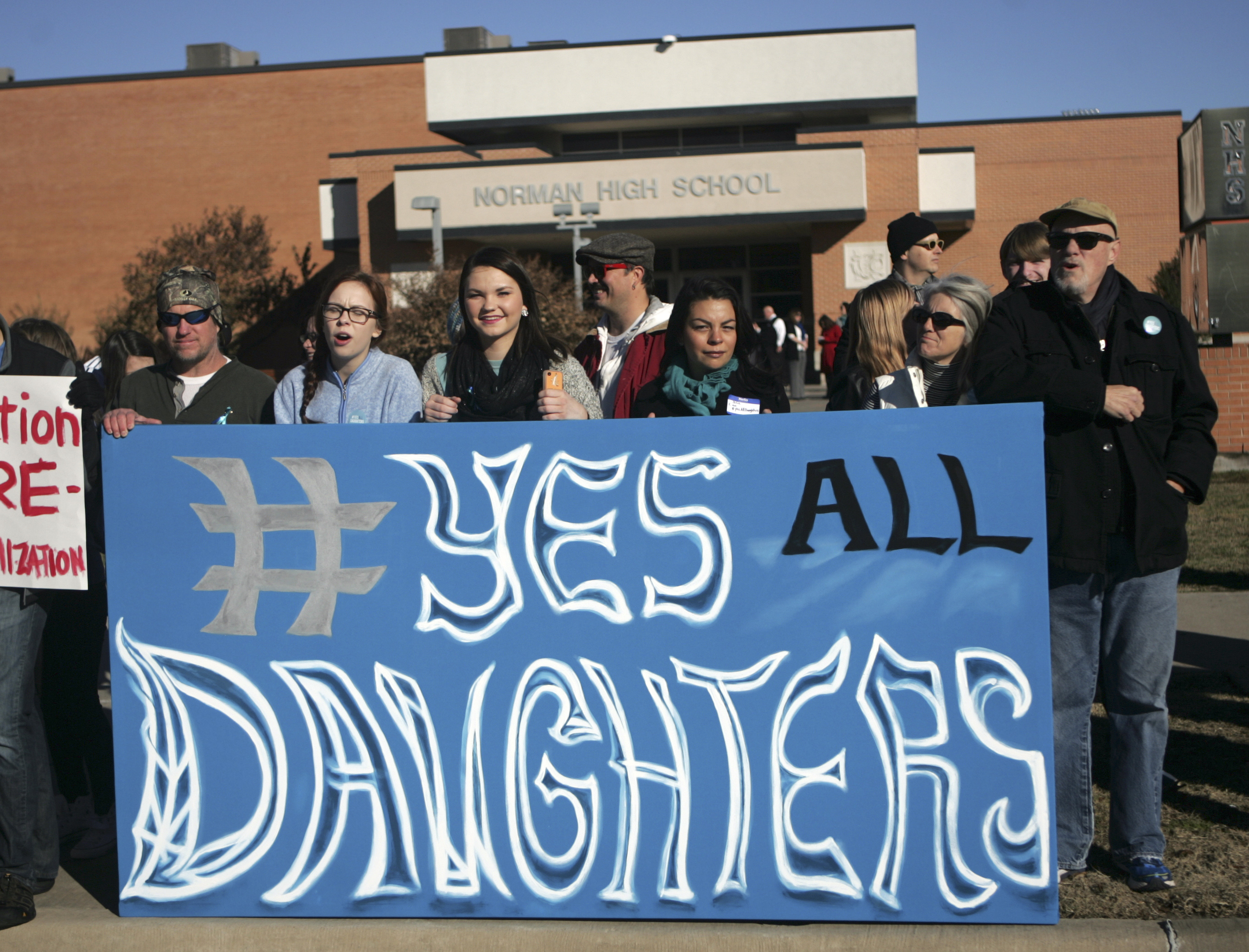 Students and parents holds up a sign during protest outside Norman High School, Monday, Nov. 24, 2014, in Norman, Okla. (Jay Chilton—AP)