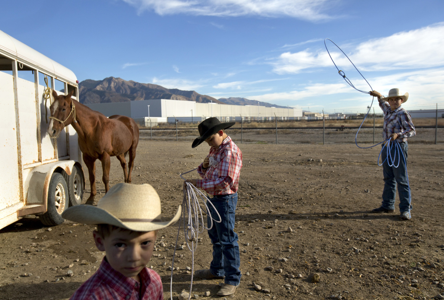 Youth rodeo, a nine-month-a-year sport, is as much of a way of life in Ogden, Utah, as it is an extracurricular activity. Here, from left, brothers Ridge, 5, Rustry, 11, and Jager Rinderknecht, 13, practiced in the parking lot before a competition, Oct. 14, 2014.