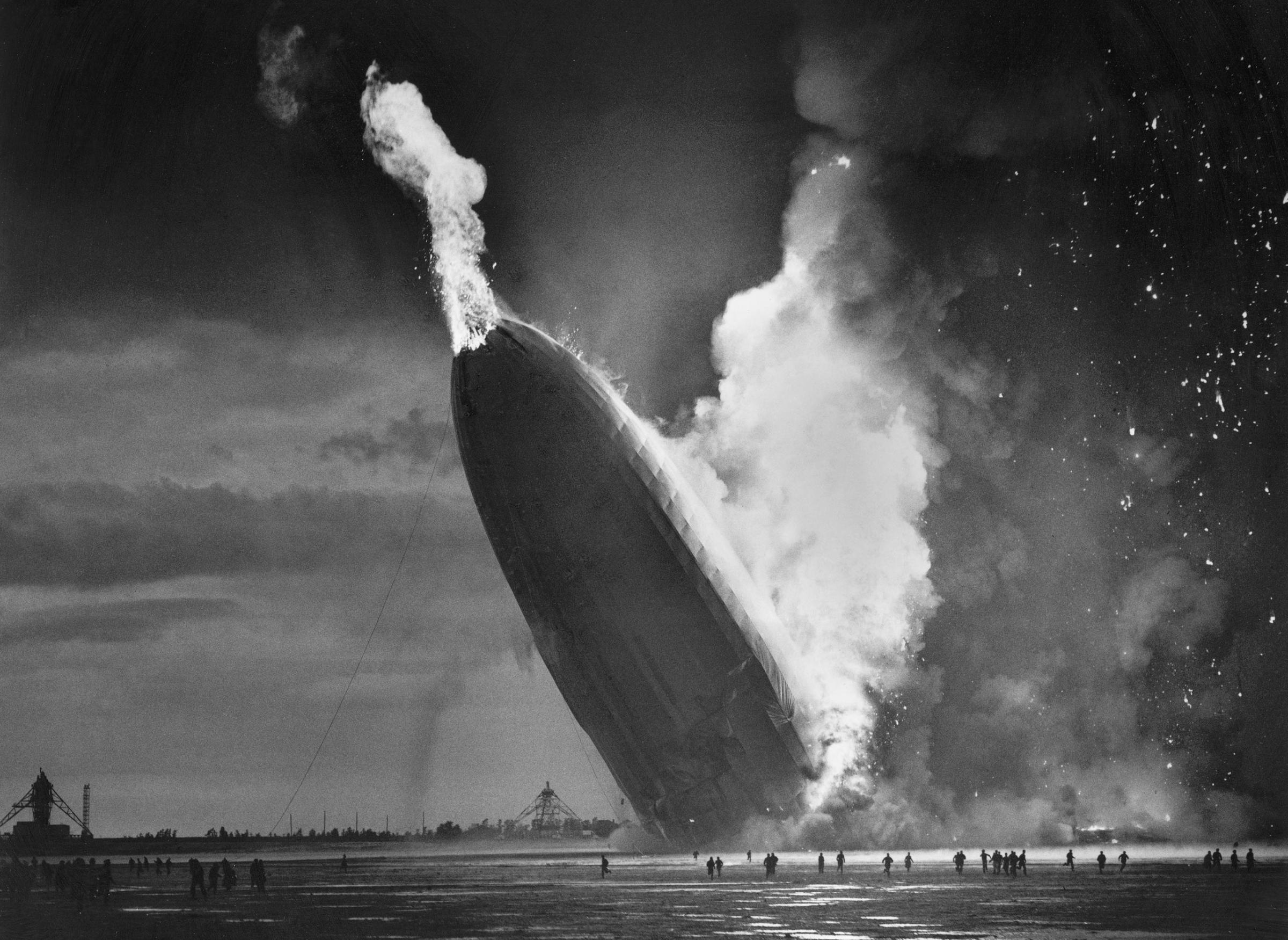 The German dirigible Hindenburg crashes to earth, tail first, in flaming ruins after exploding on May 6, 1937, at the U.S. Naval Station in Lakehurst, N.J.