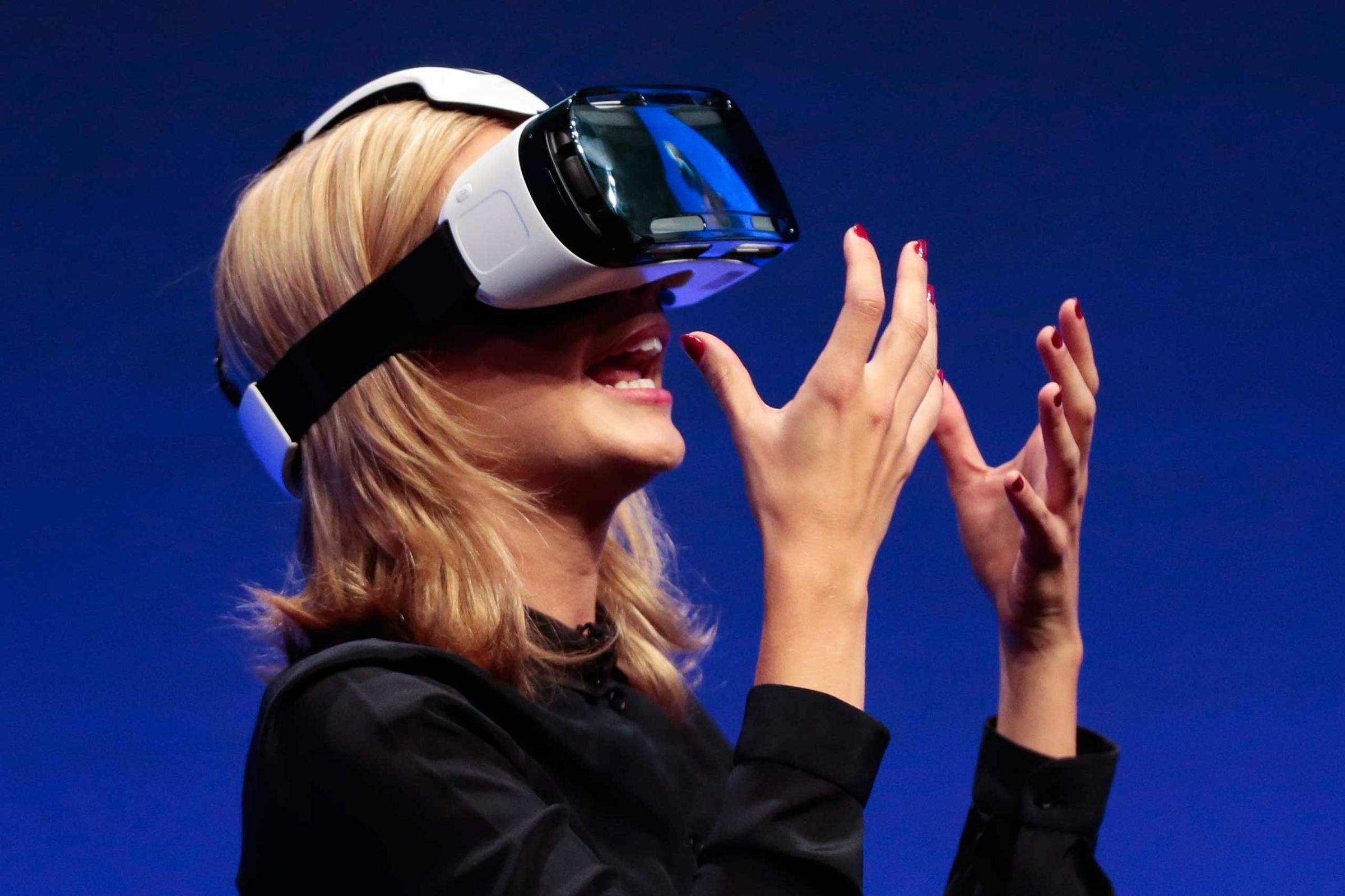 British television presenter Rachel Riley showed a virtual-reality headset called Gear VR during a Samsung event ahead of the consumer electronic fair IFA in Berlin.