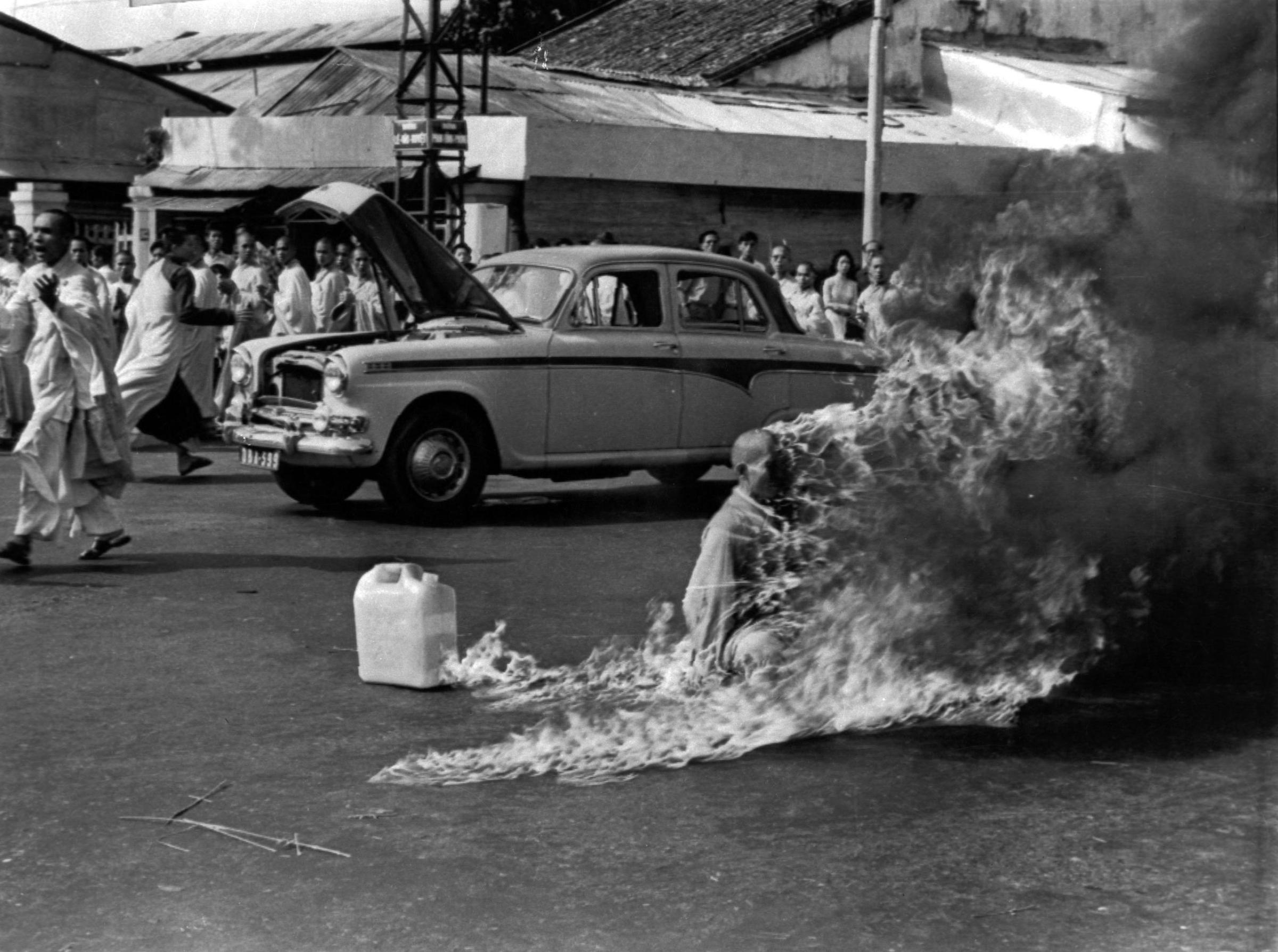 The Reverend Thich Quang Duc, a 73-year-old Buddhist monk, is soaked in petrol before setting fire to himself and burning to death in front of thousands of onlookers at a main highway intersection in Saigon on June 11, 1963.