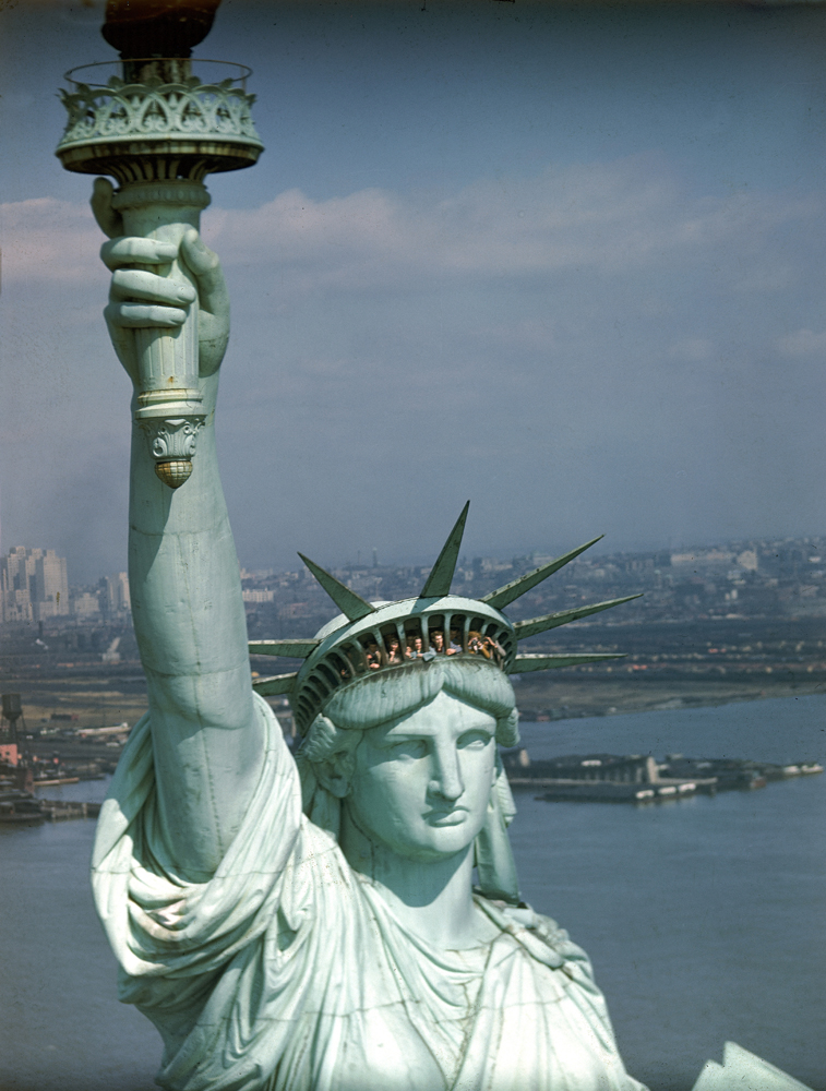 Tourists gaze from the crown of the Statue of Liberty, 1947.