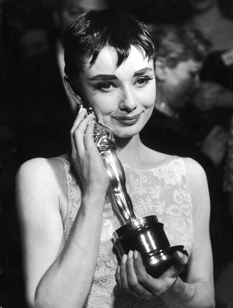 Audrey Hepburn holds the Oscar she won for her performance in 'Roman Holiday,' 1954.