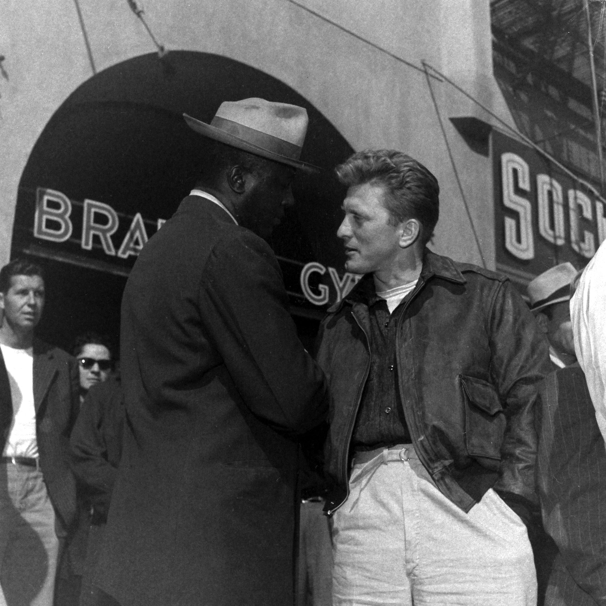 Kirk Douglas with unidentified man, 1949.