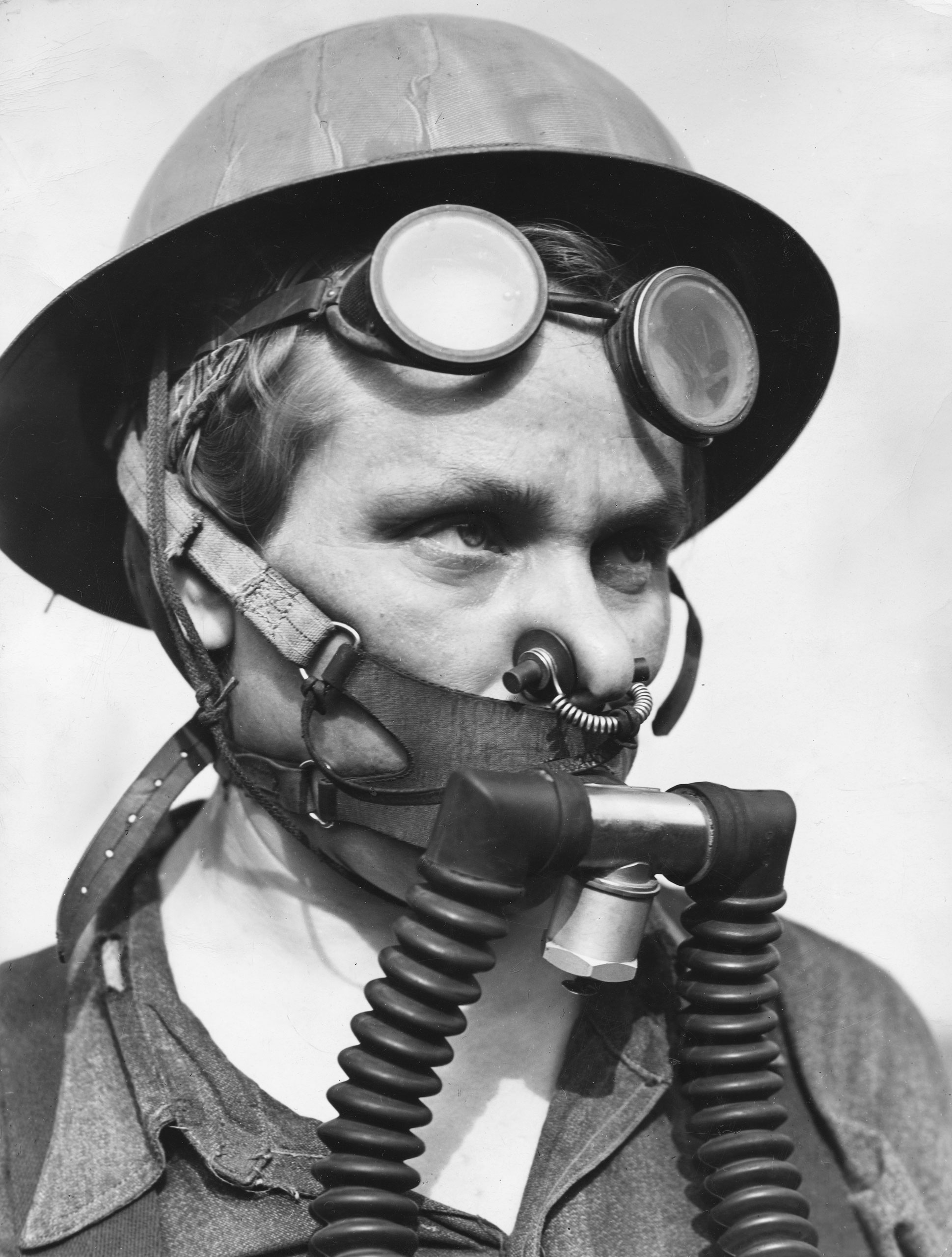 Bernice Daunora, 31, a member of a steel mill's "top gang" who must wear a "one-hour, lightweight breathing apparatus" as protection against gas escaping from blast furnaces, Gary, Ind., 1943.