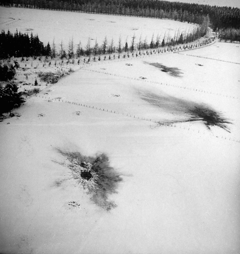 Shell craters left by an Allied barrage laid down to clean German infantry out of the woods and fields during the Battle of the Bulge, Belgium, 1944.