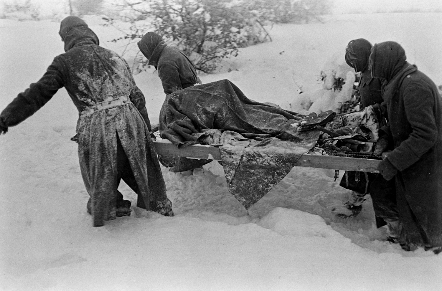 German POWs on grave-digging duty during the Battle of the Bulge.