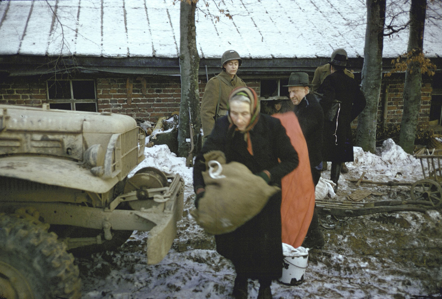 Belgian civilians are evacuated by American troops, 1944.