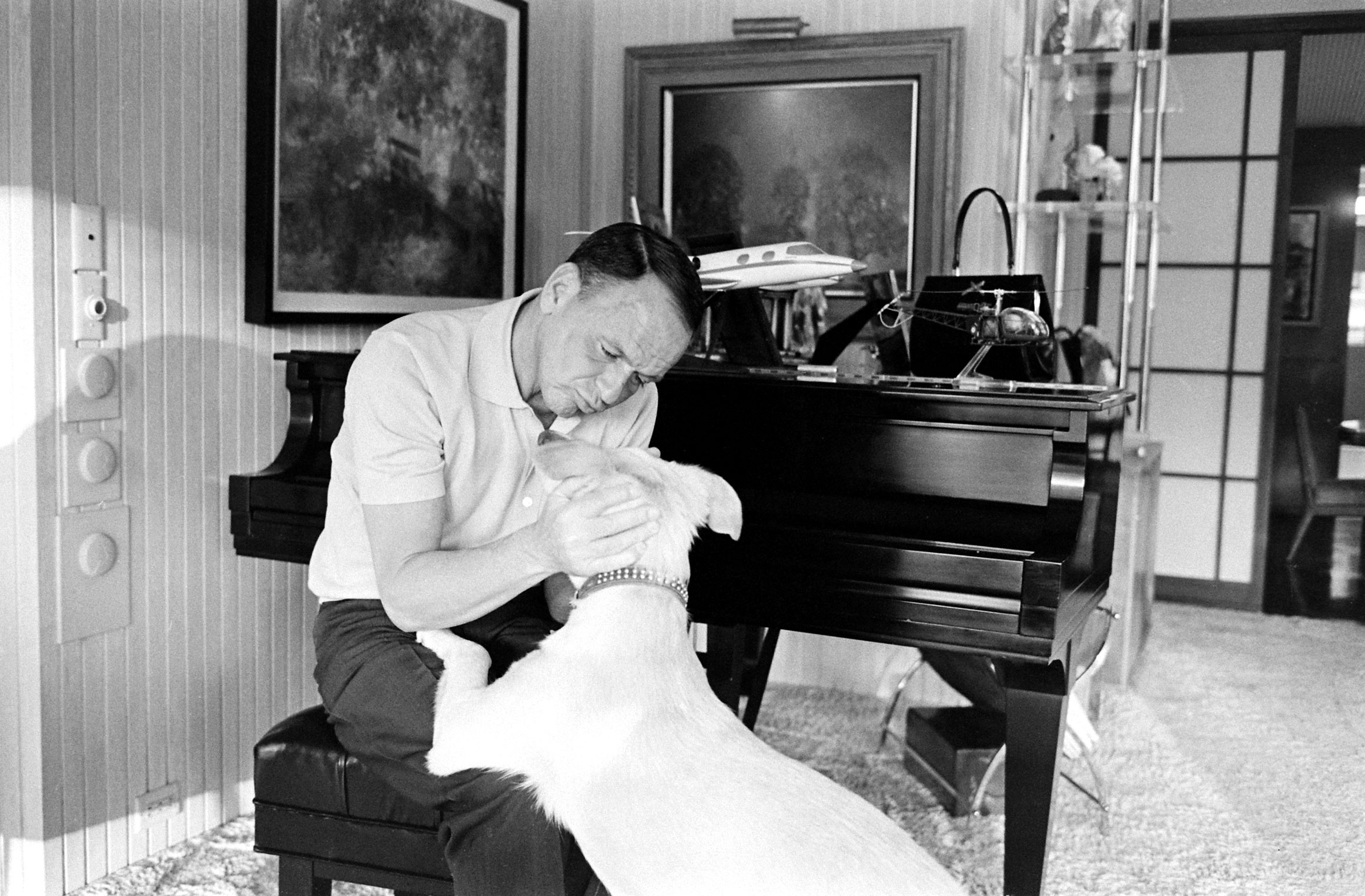 Frank Sinatra and his dog, Ringo, at Sinatra's home in Palm Springs, California, in 1965.