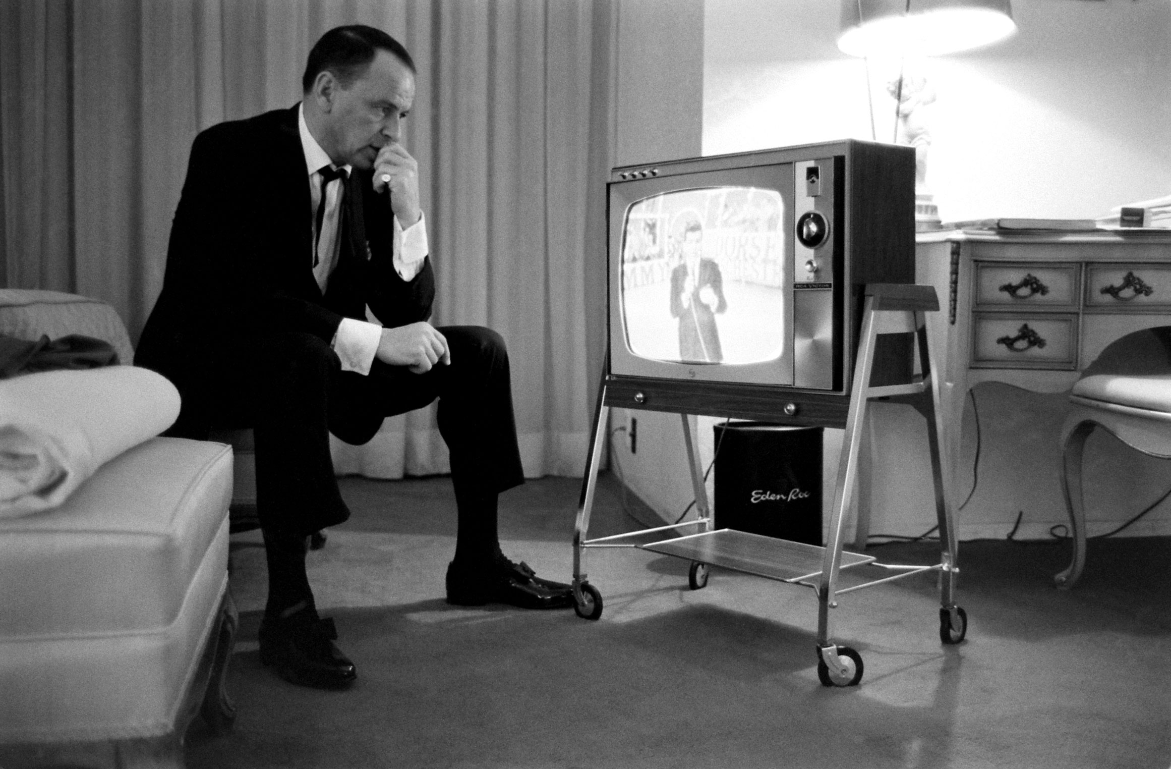 Frank Sinatra watches his son on television, 1965