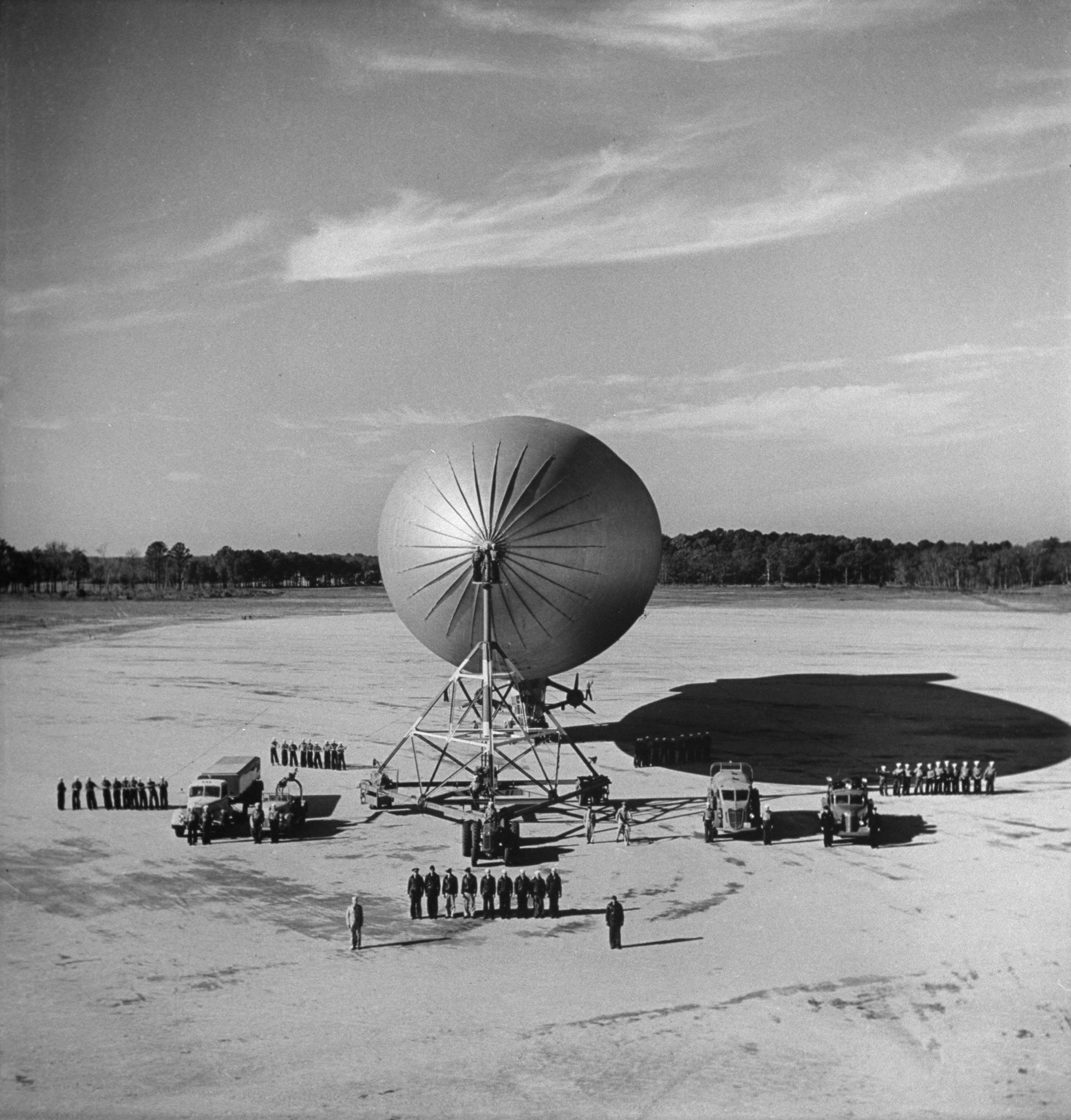 A blimp lands at a Naval air station in 1942.