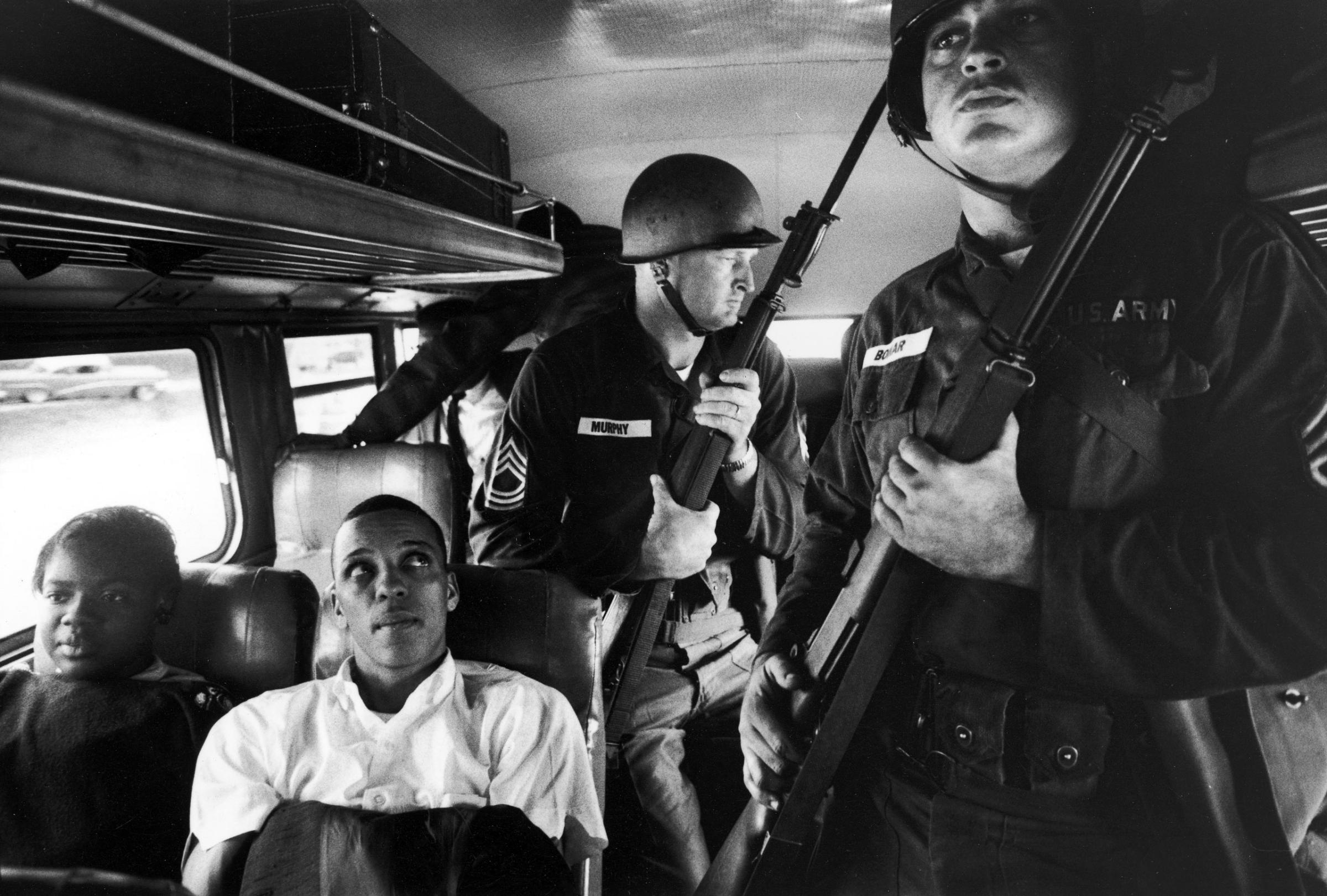 Julia Aaron and David Dennis, along with 25 other freedom riders and several members of the National Guard, travel from Montgomery, Ala., to Jackson, Miss.