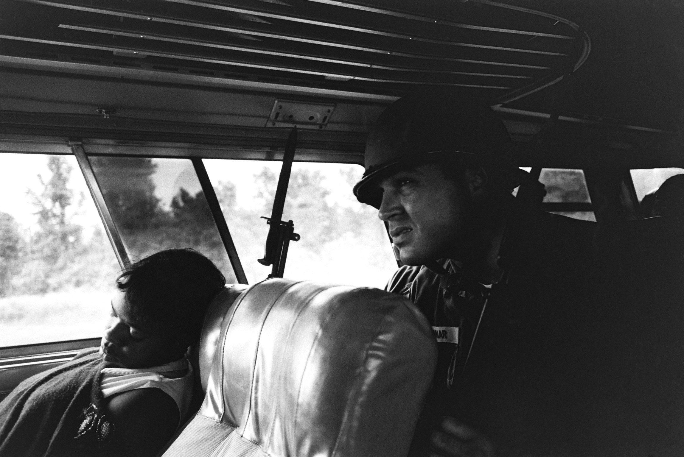 A freedom rider and member of the National Guard on a bus in the Deep South.