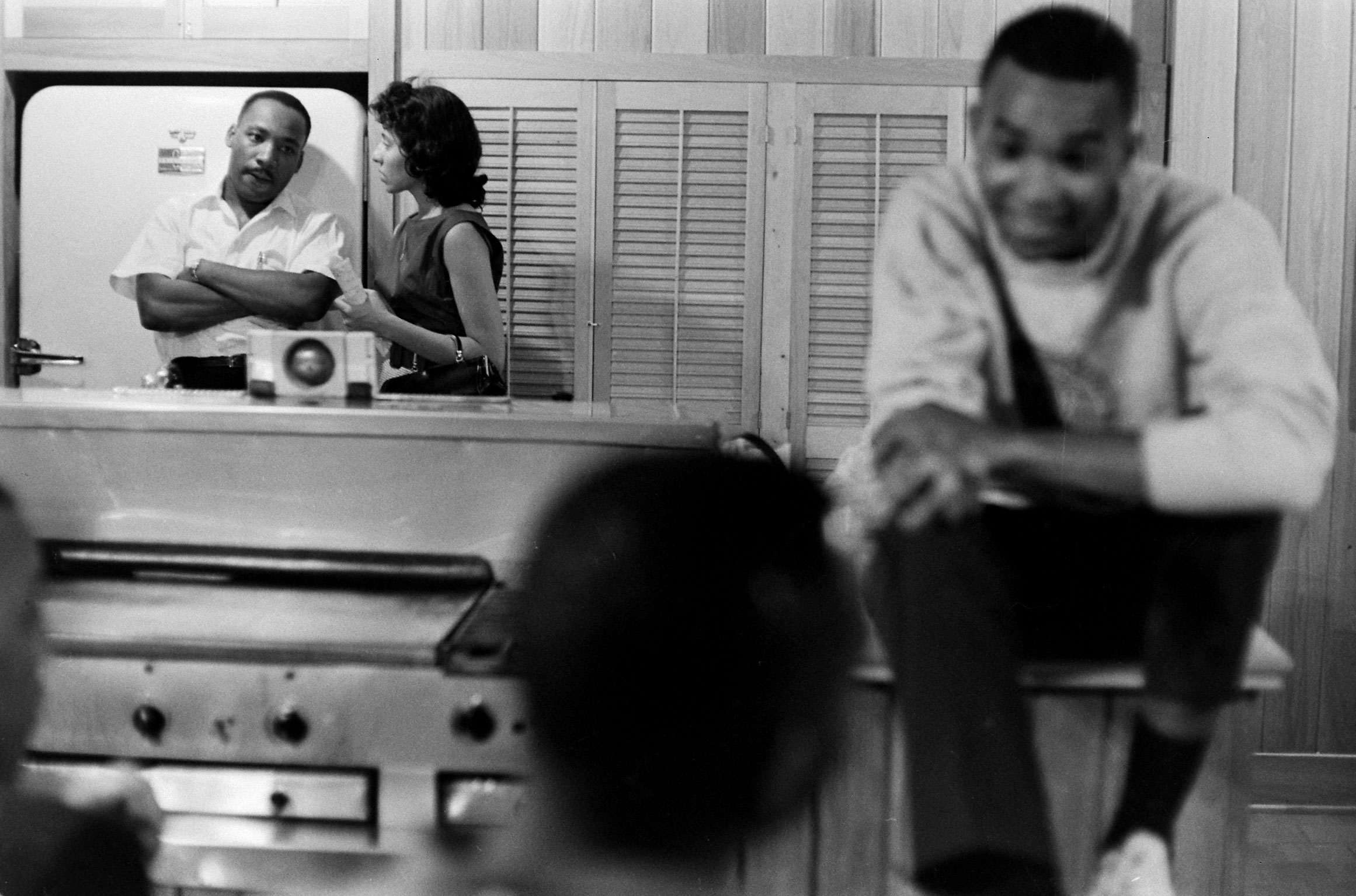 Freedom riders, along with Martin Luther King Jr., relax at a safe house in Montgomery, Ala.