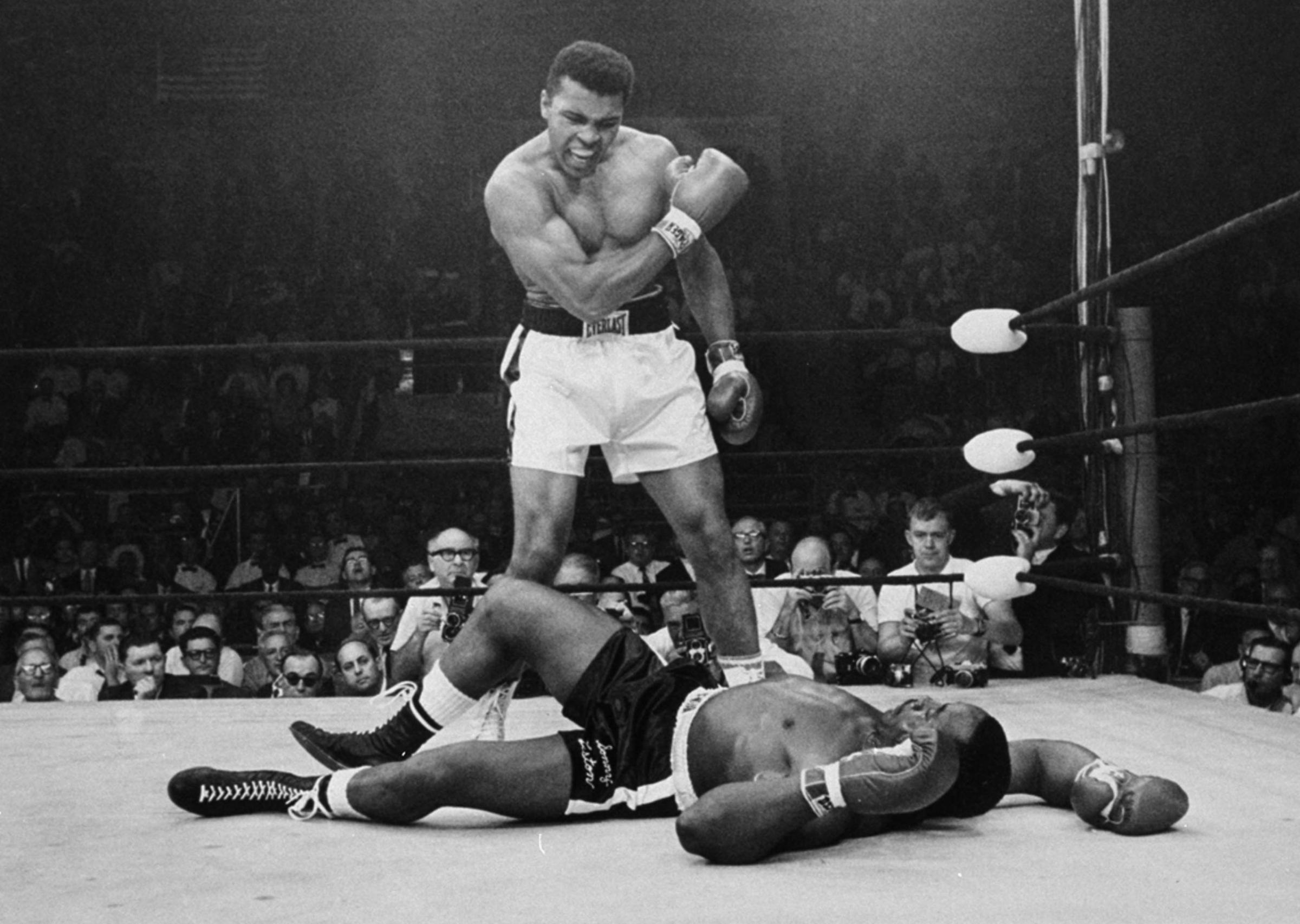 Heavyweight champion Muhammad Ali stands over fallen challenger Sonny Liston on May 25, 1965, in Lewiston, Maine.