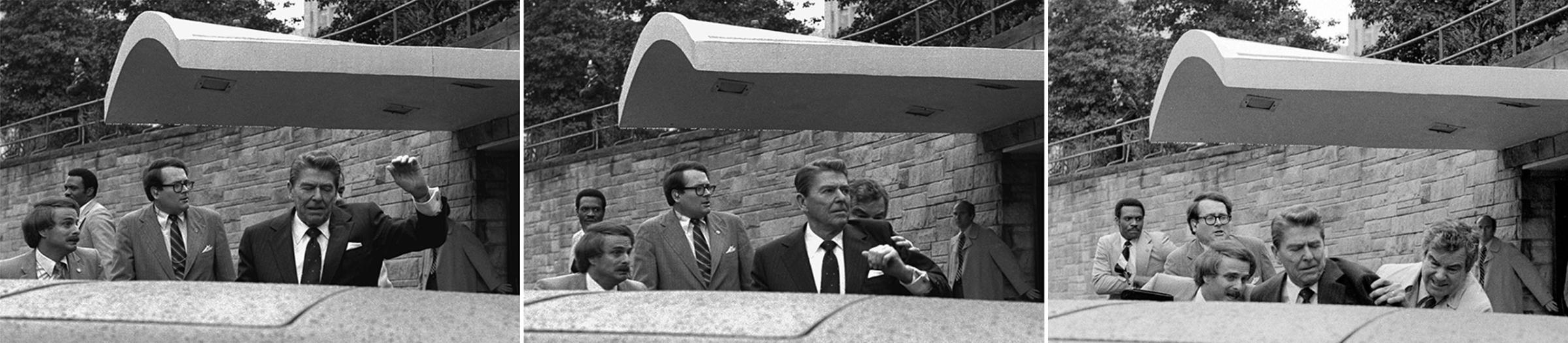 U.S. President Ronald Reagan raises his left arm as he is shot at by an assailant outside a hotel in Washington, D.C., on March 30, 1981.